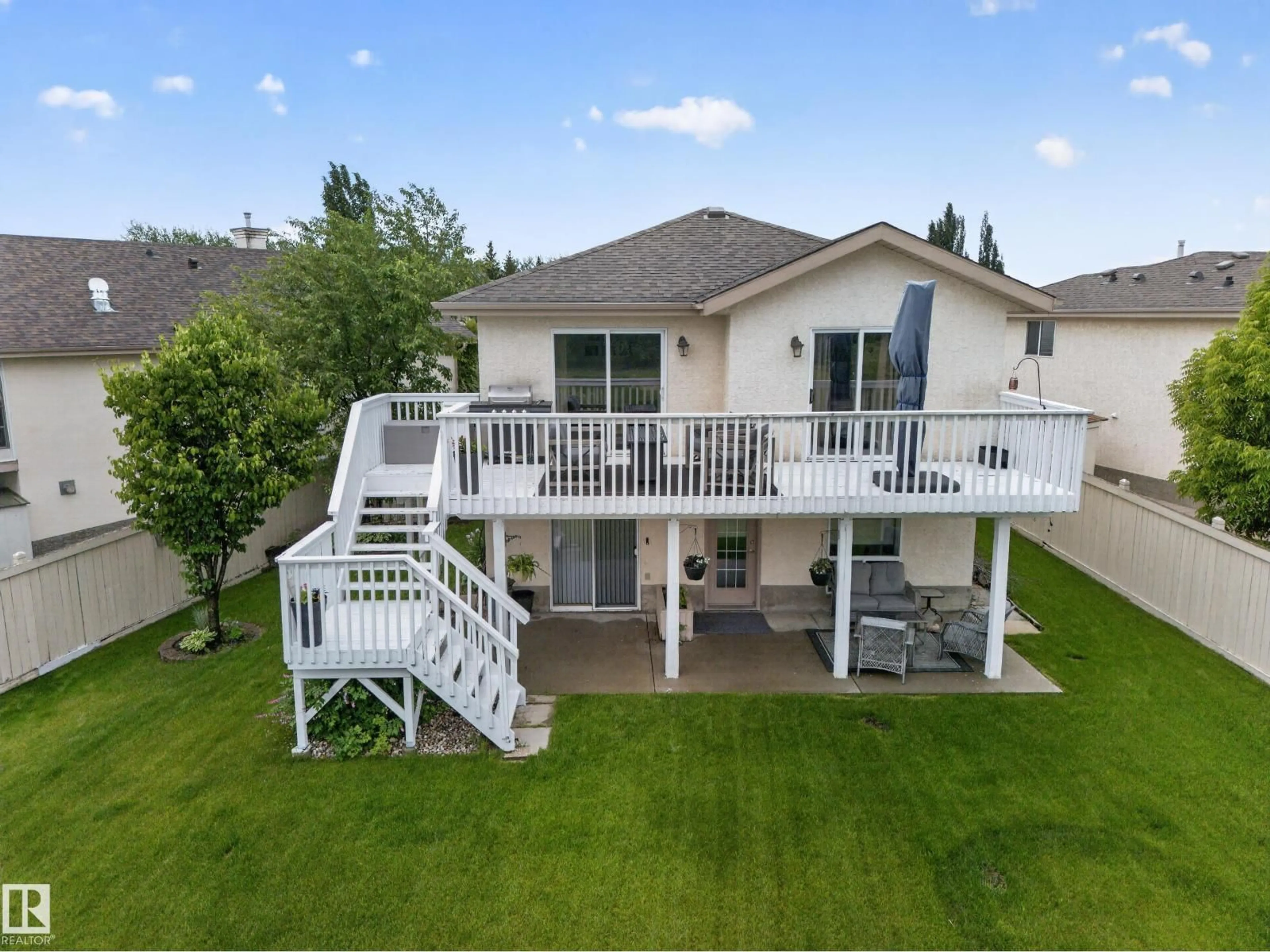 A pic from outside/outdoor area/front of a property/back of a property/a pic from drone, water/lake/river/ocean view for 27 FAIRWAY GR, Stony Plain Alberta T7Z1M4