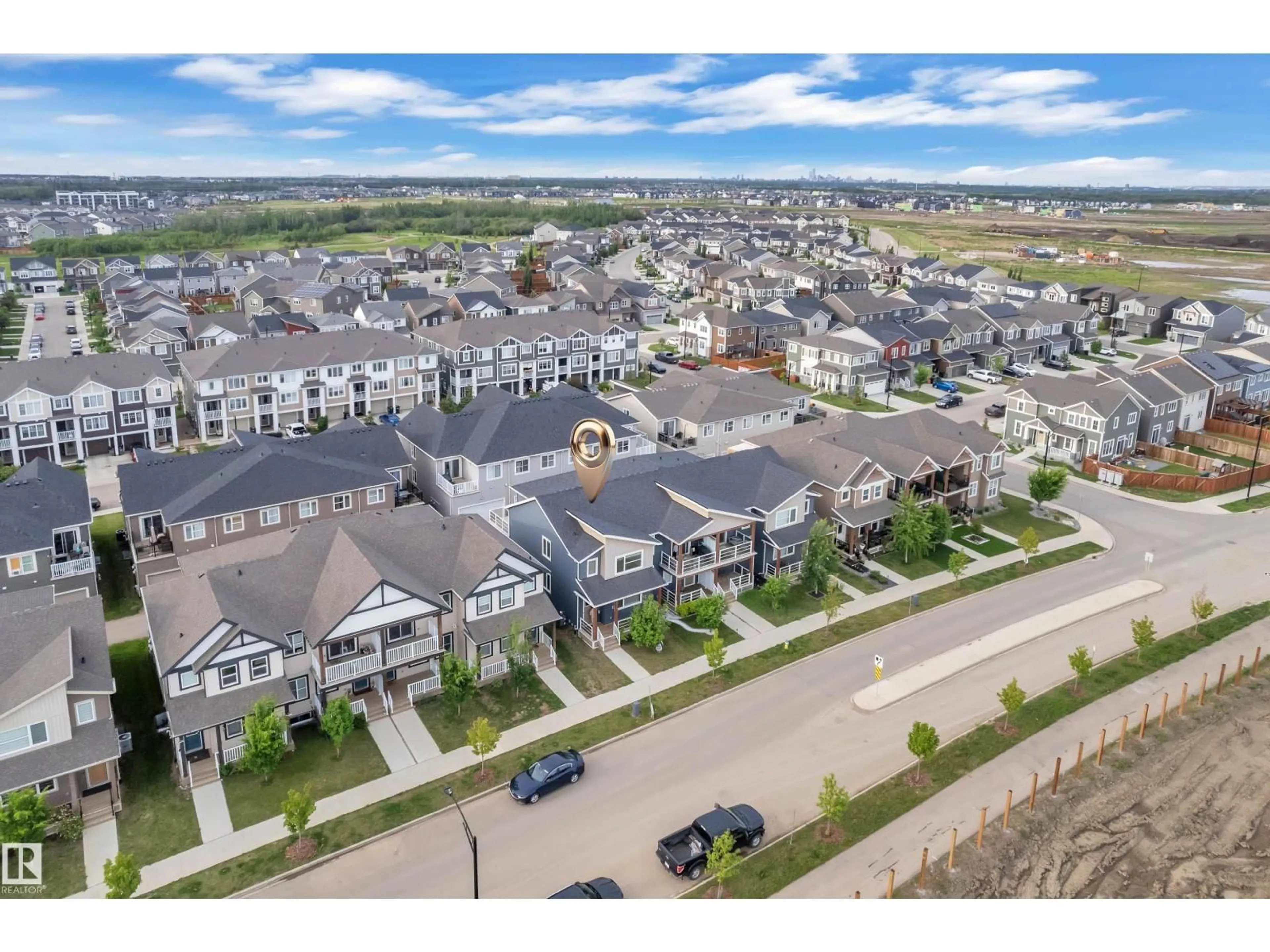 A pic from outside/outdoor area/front of a property/back of a property/a pic from drone, mountain view for 144 SUNWAPTA WY, Edmonton Alberta T6M1L6