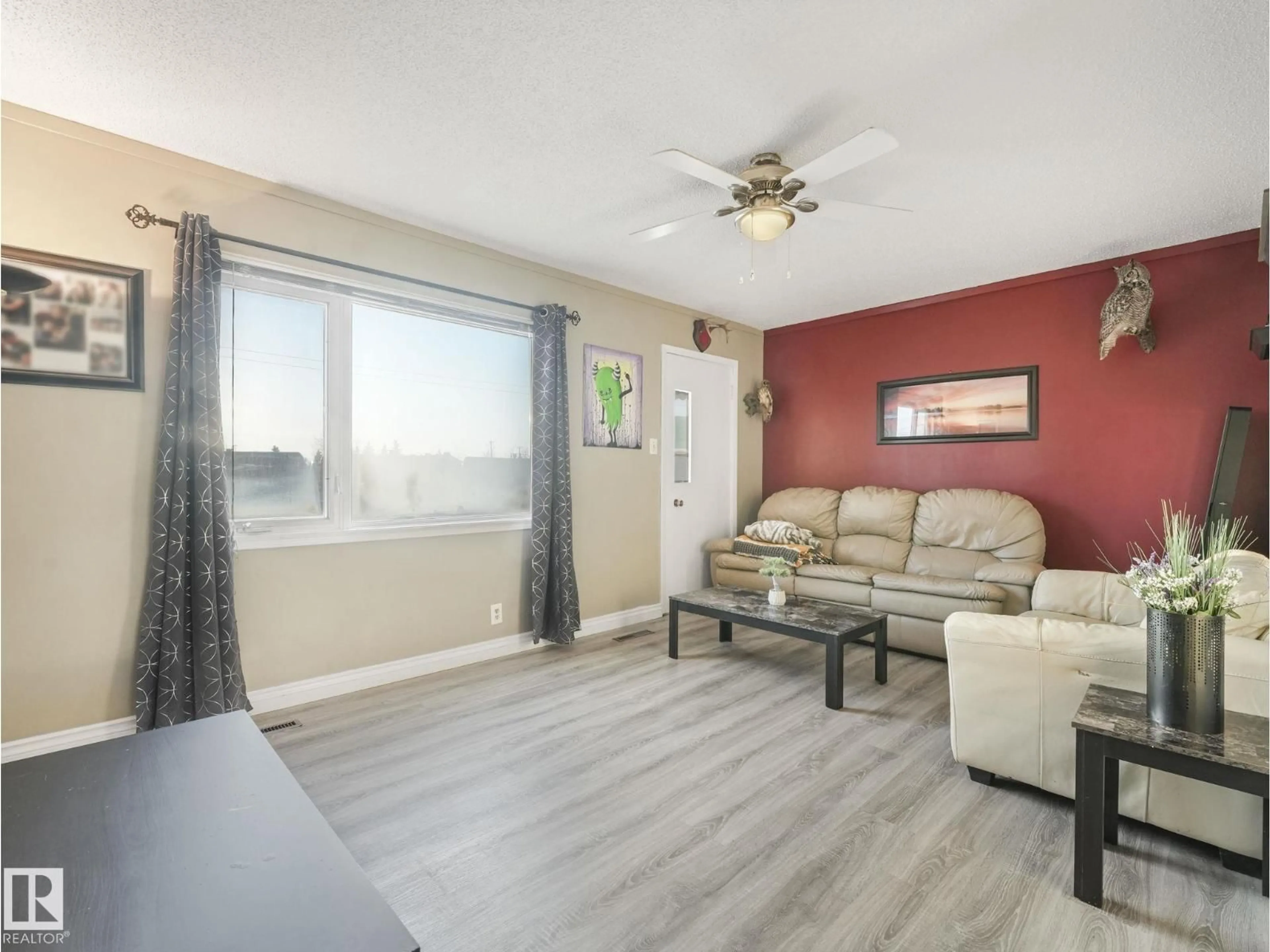 Living room with furniture, wood/laminate floor for 5305 46 ST, Leduc Alberta T9E5W2