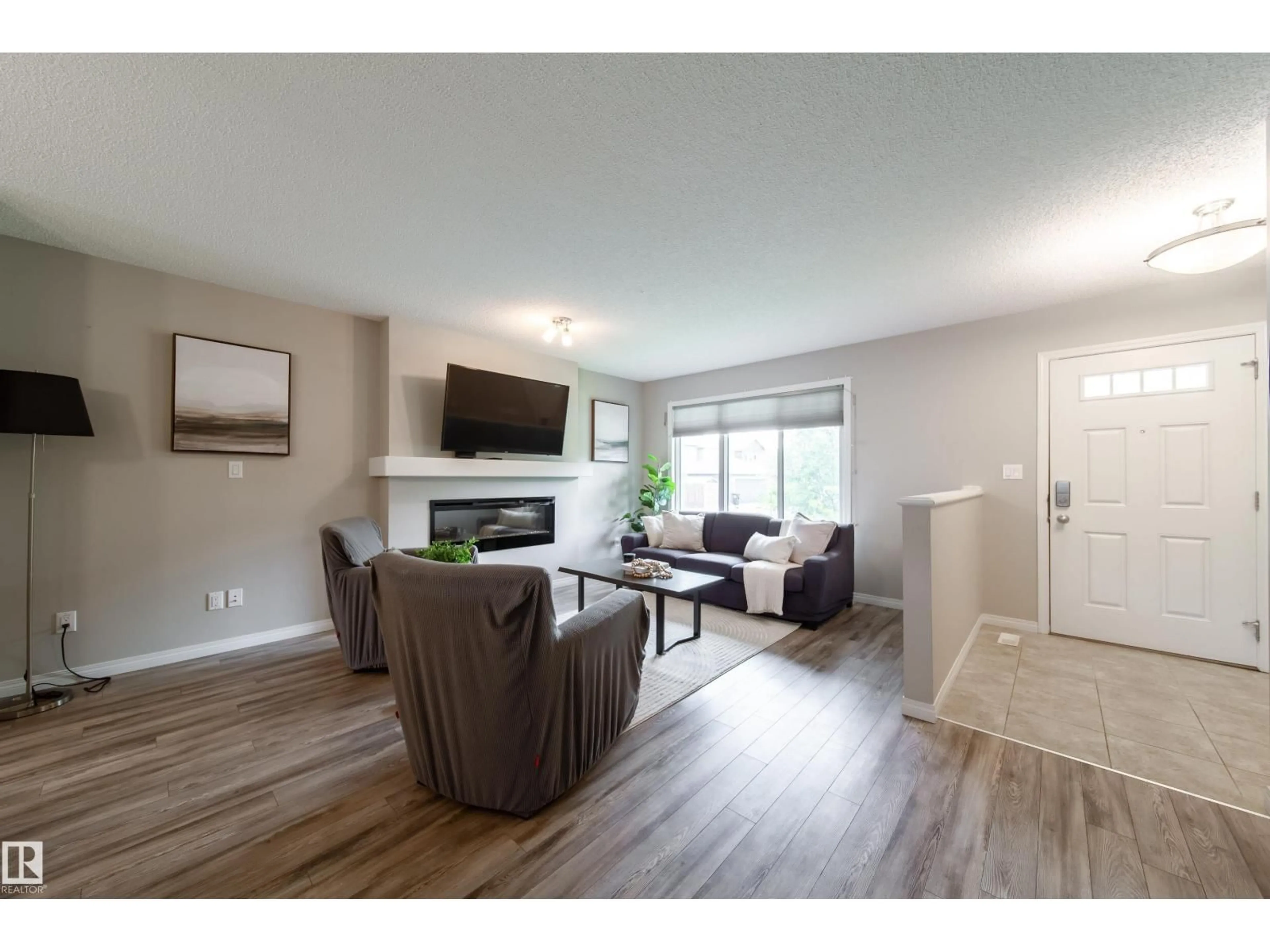 Living room with furniture, wood/laminate floor for SW - 3211 CHERRY CR, Edmonton Alberta T6X1Y5