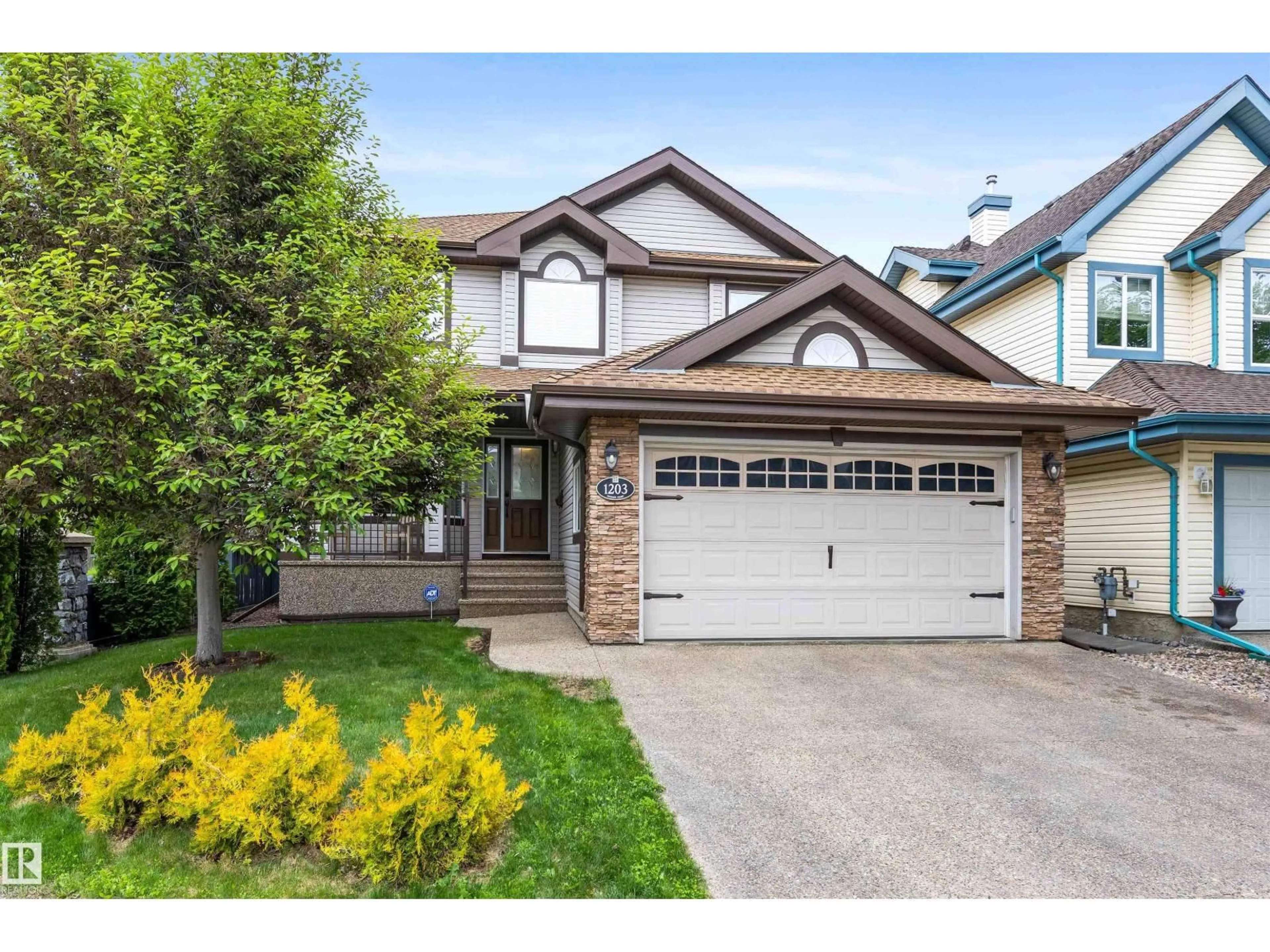 Home with vinyl exterior material, street for 1203 TREDGER CT, Edmonton Alberta T6M3P2