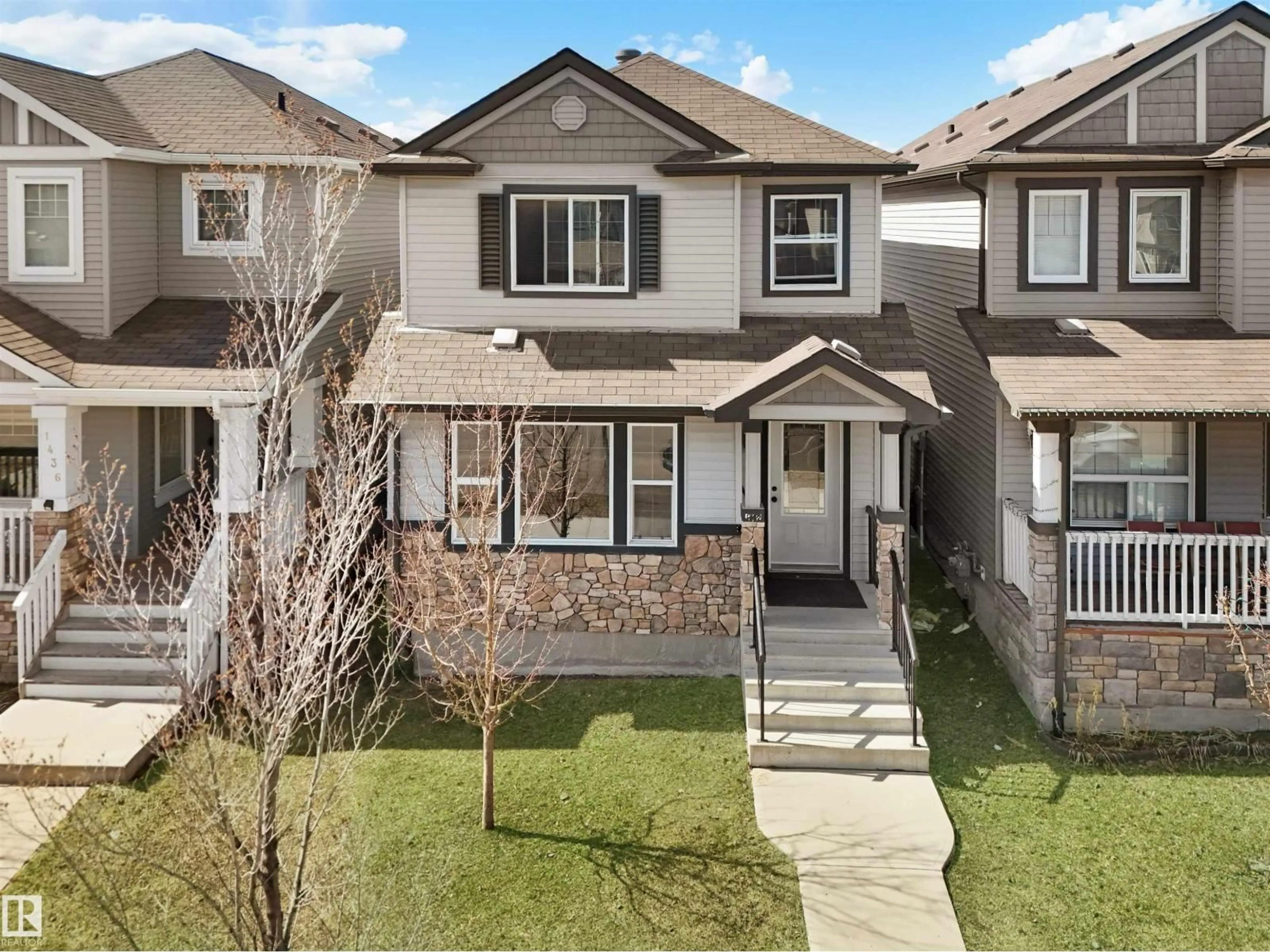 Home with vinyl exterior material, street for NW - 1442 33A ST, Edmonton Alberta T6T0V3