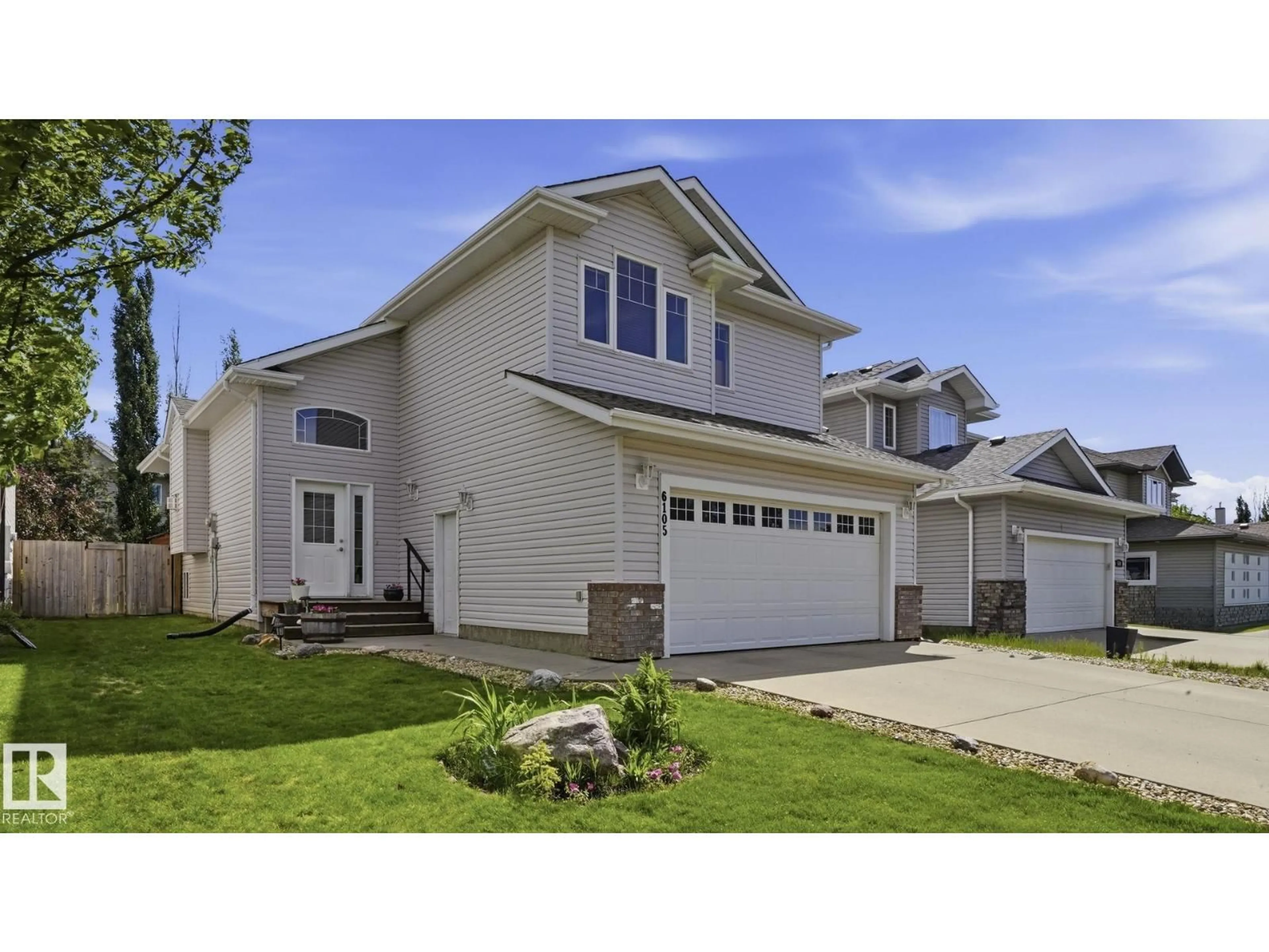 Home with vinyl exterior material, street for 6105 52 AV, Beaumont Alberta T4X1V5