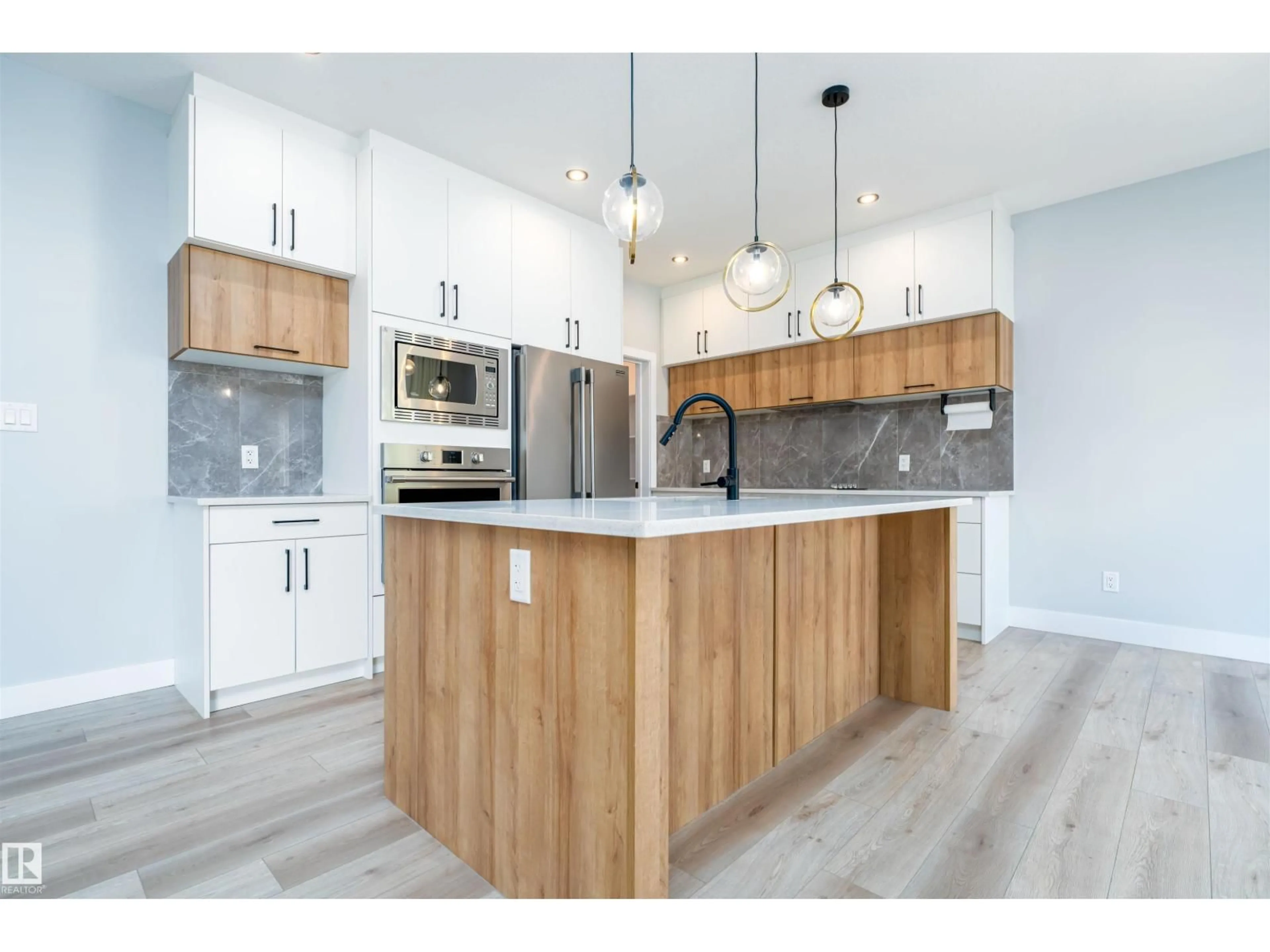 Open concept kitchen, wood/laminate floor for SW - 17320 9 AV, Edmonton Alberta T6W3V3