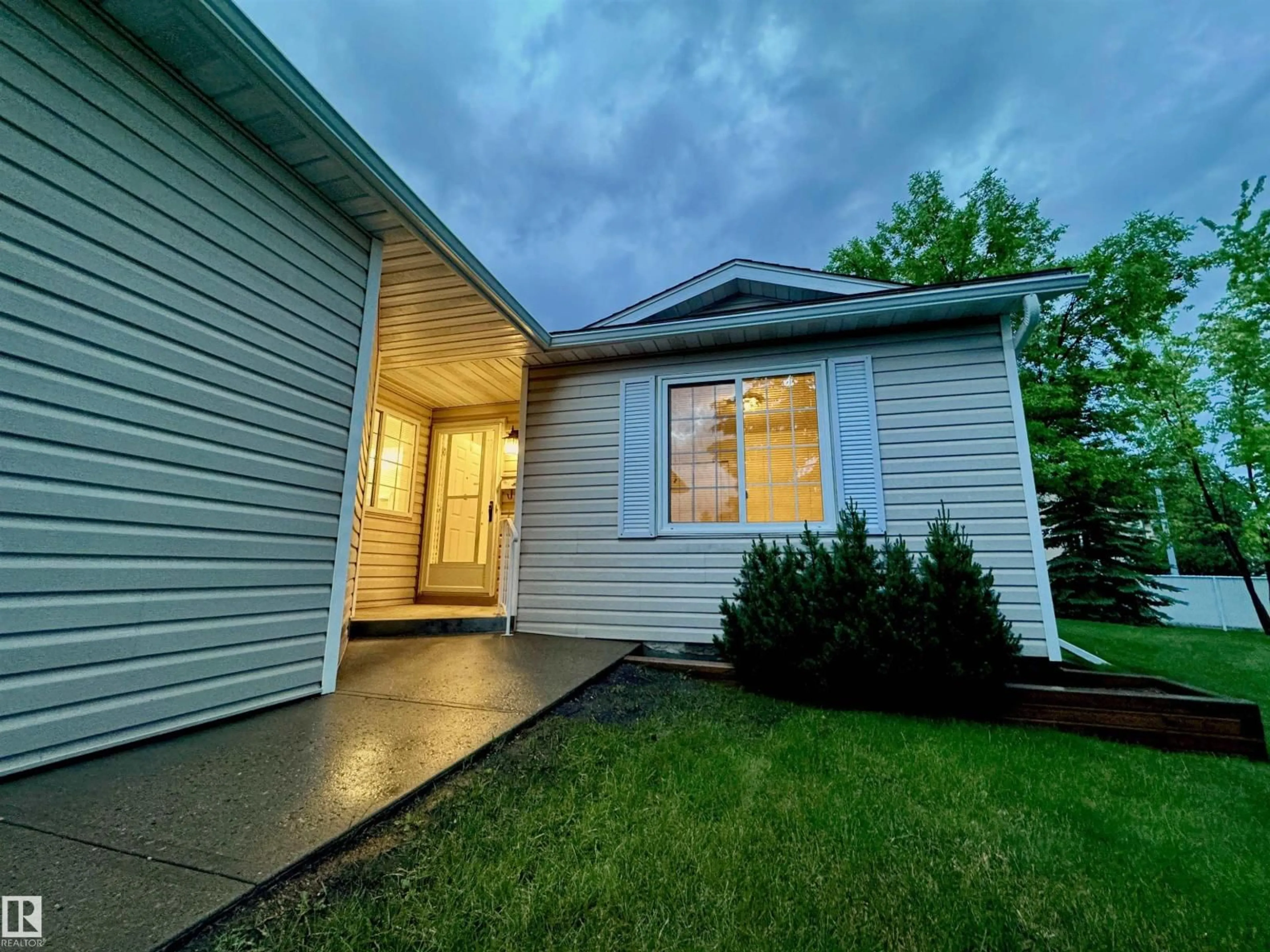 Home with vinyl exterior material, street for 8118 27 AV, Edmonton Alberta T6K4C9