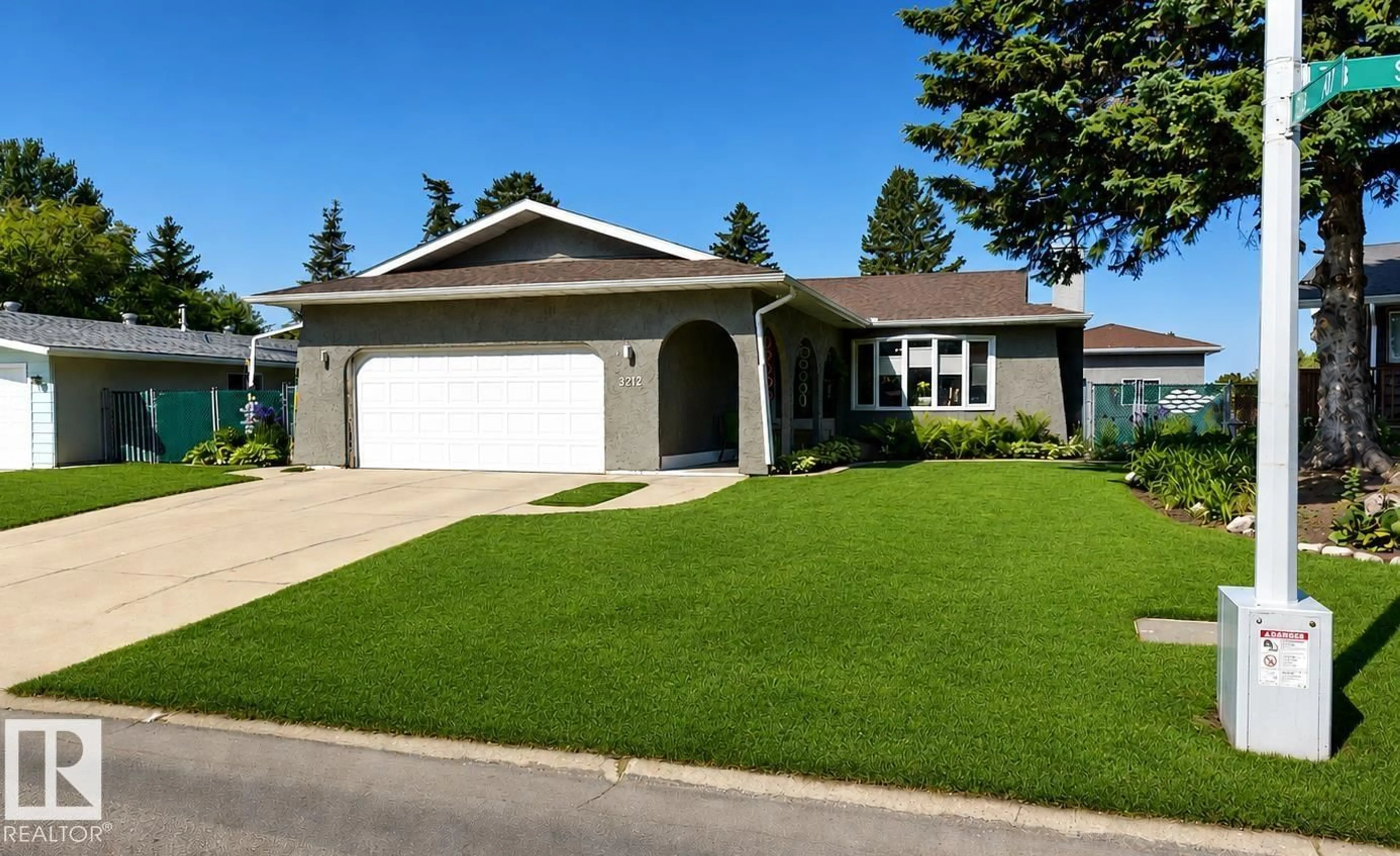 Home with vinyl exterior material, street for 3212 73 ST, Edmonton Alberta T6K1K1