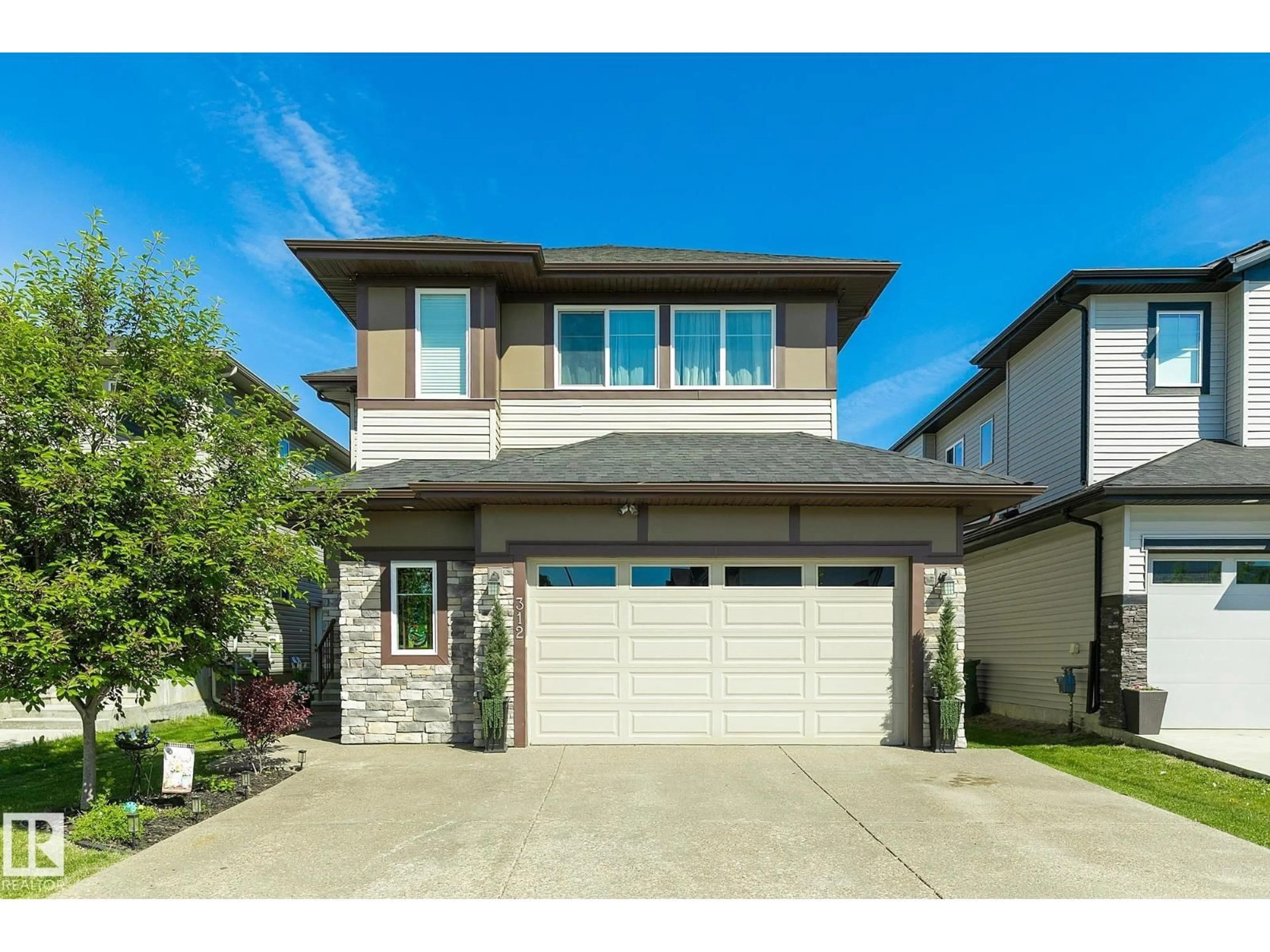 Home with vinyl exterior material, street for 312 WEST HAVEN DR, Leduc Alberta T9E1B6