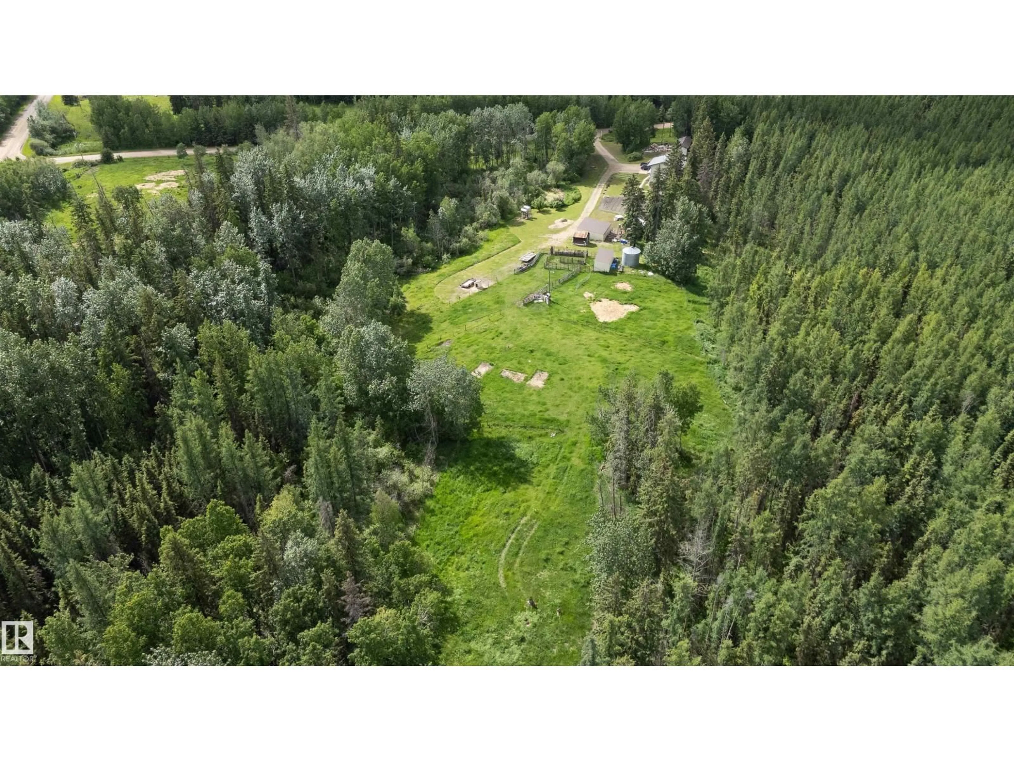 A pic from outside/outdoor area/front of a property/back of a property/a pic from drone, forest/trees view for 58403 RR 60, Rural Barrhead County Alberta T7N1N3