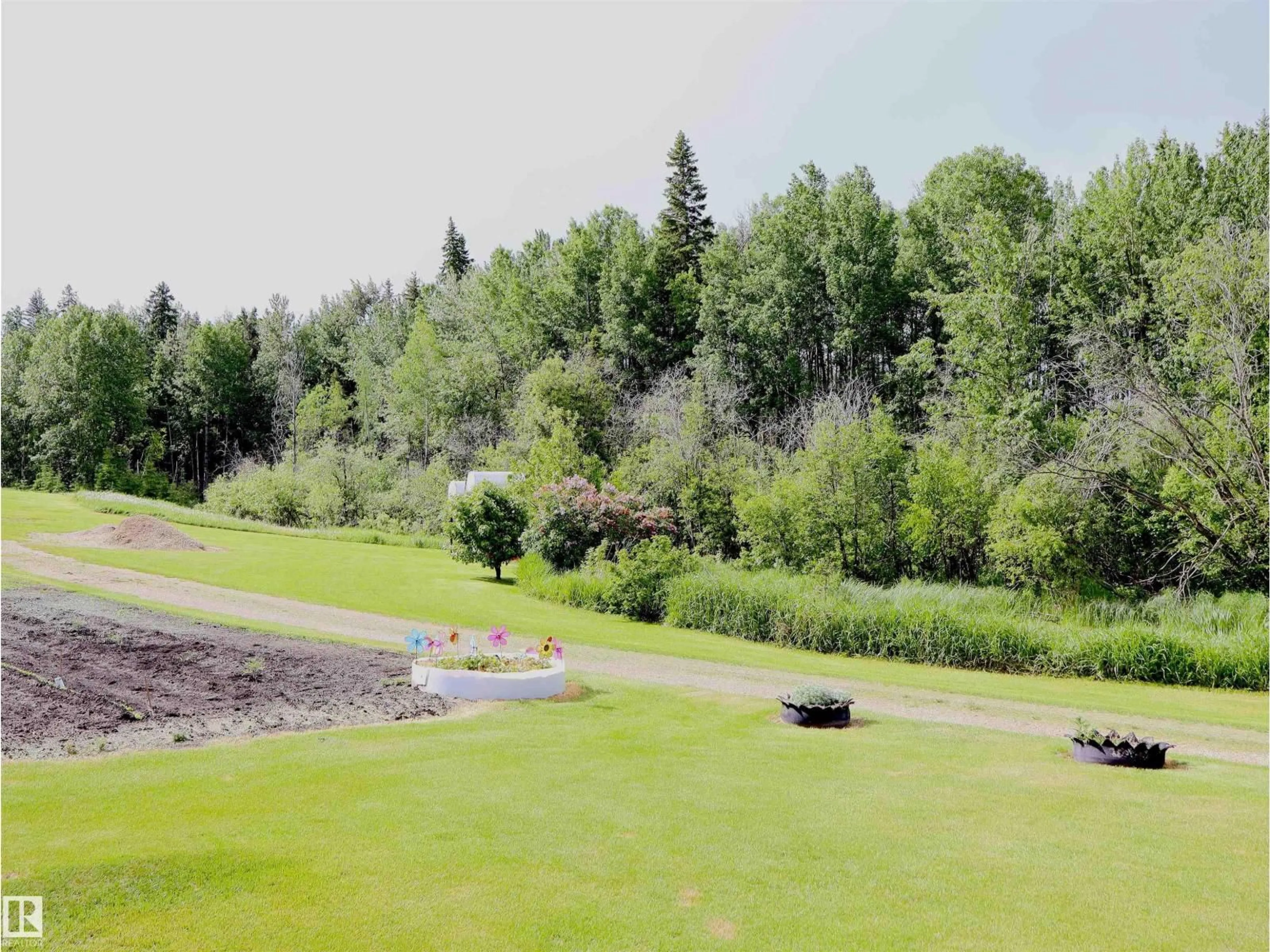 A pic from outside/outdoor area/front of a property/back of a property/a pic from drone, water/lake/river/ocean view for 58403 RR 60, Rural Barrhead County Alberta T7N1N3