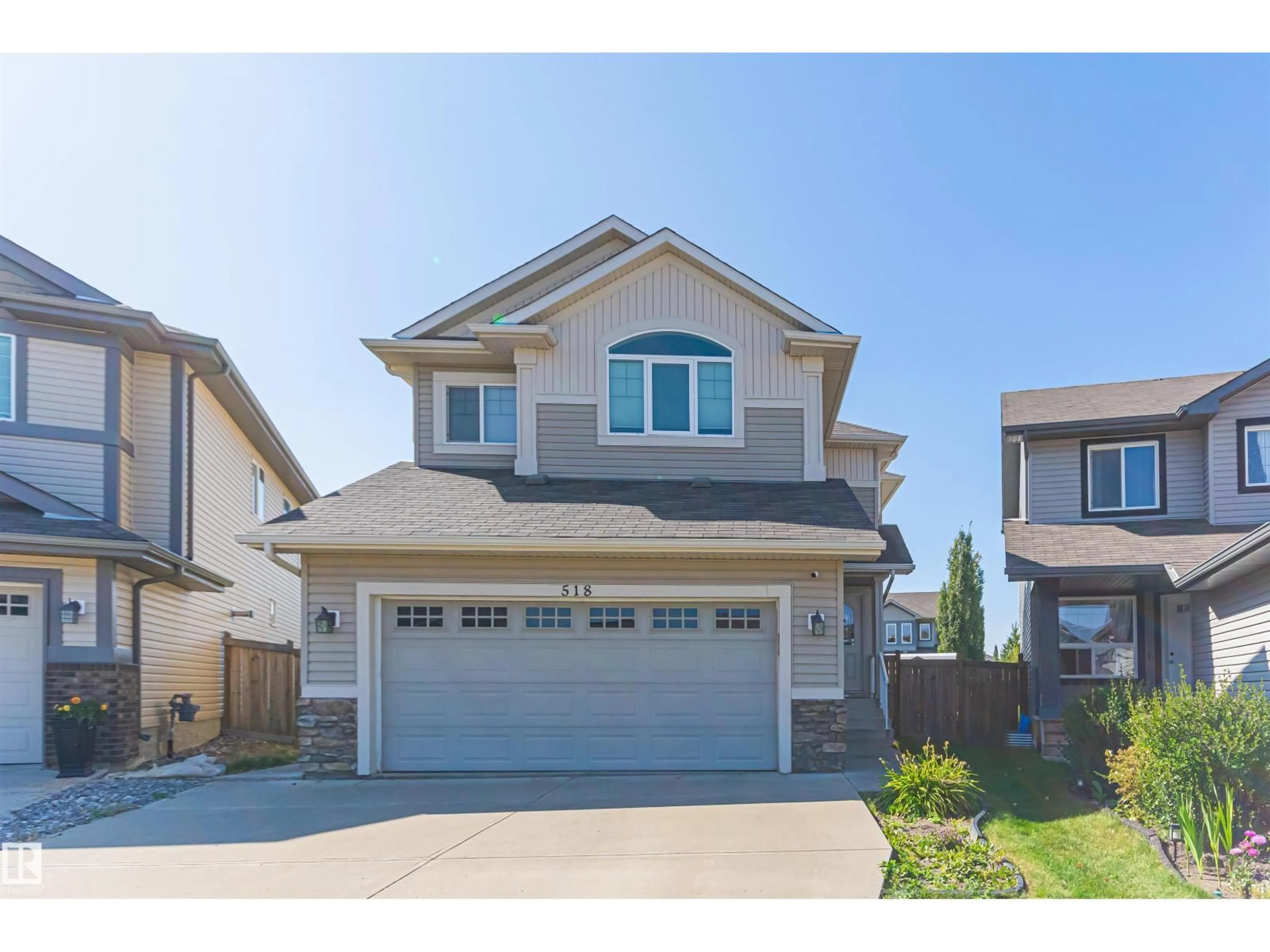 Home with vinyl exterior material, street for 518 173A STREET SW, Edmonton Alberta T6W2A5