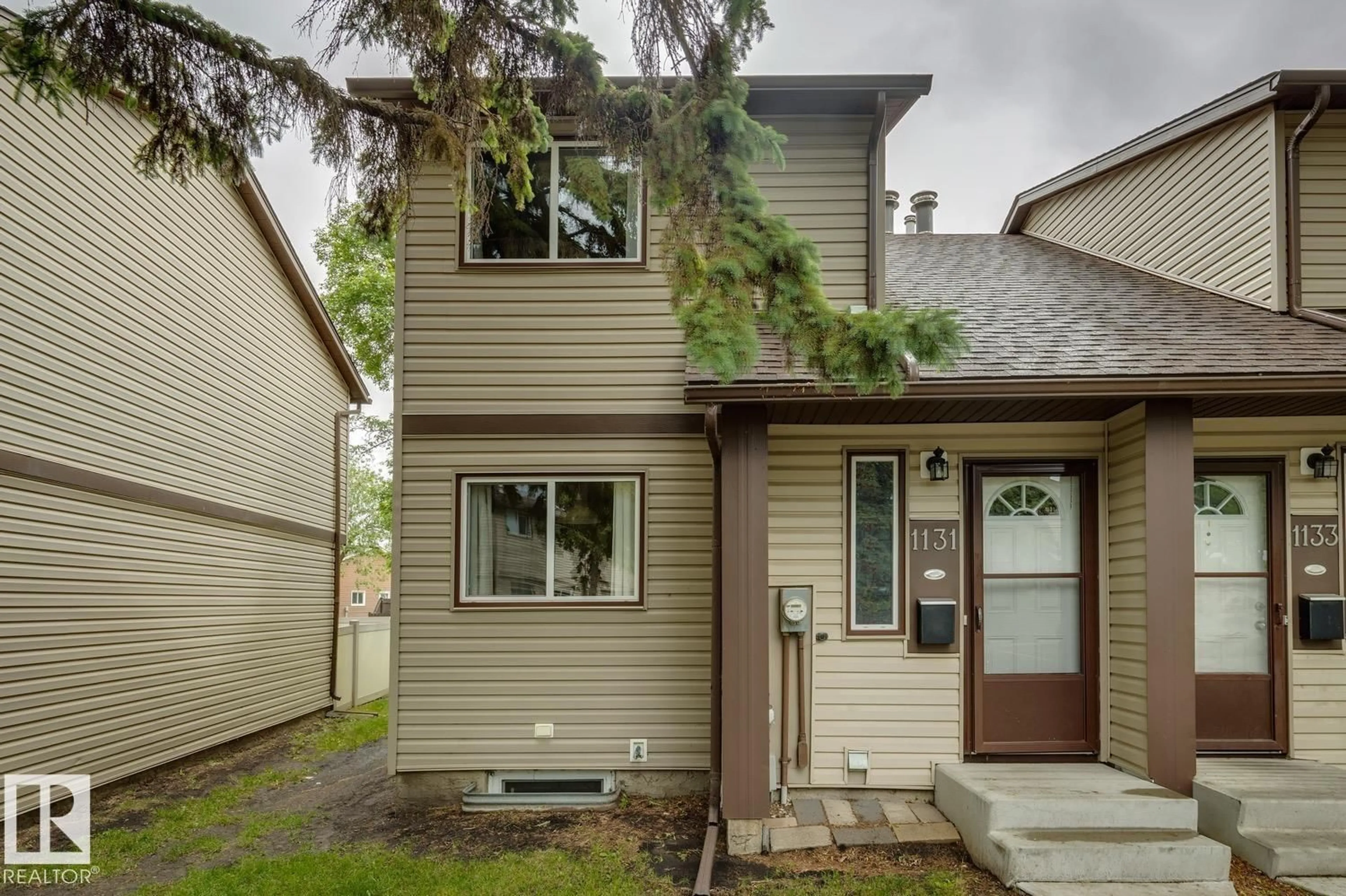 Home with vinyl exterior material, street for 1131 HOOKE RD, Edmonton Alberta T5A4A5