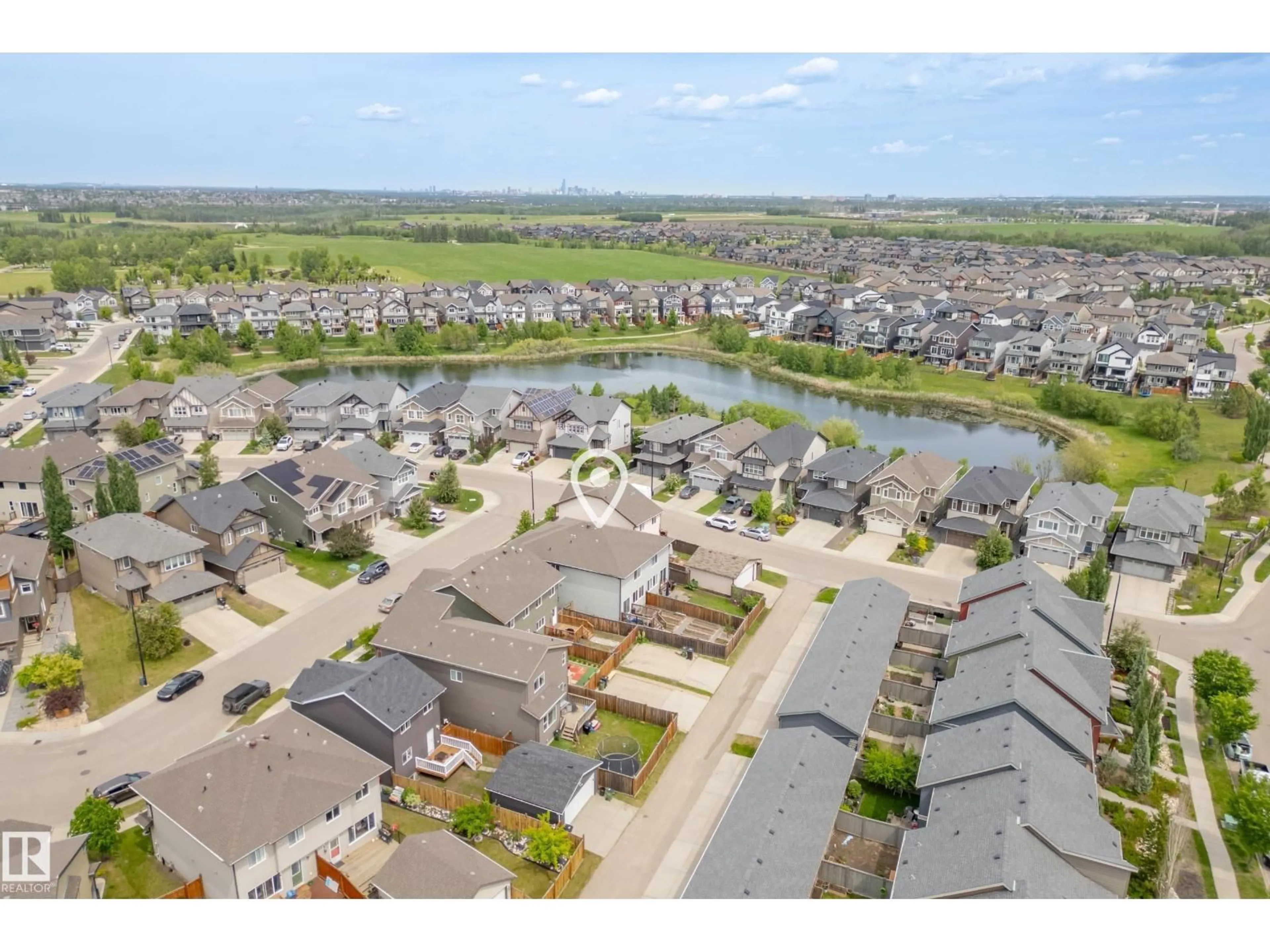 A pic from outside/outdoor area/front of a property/back of a property/a pic from drone, water/lake/river/ocean view for SW - 3805 POWELL WD, Edmonton Alberta T6W2W9