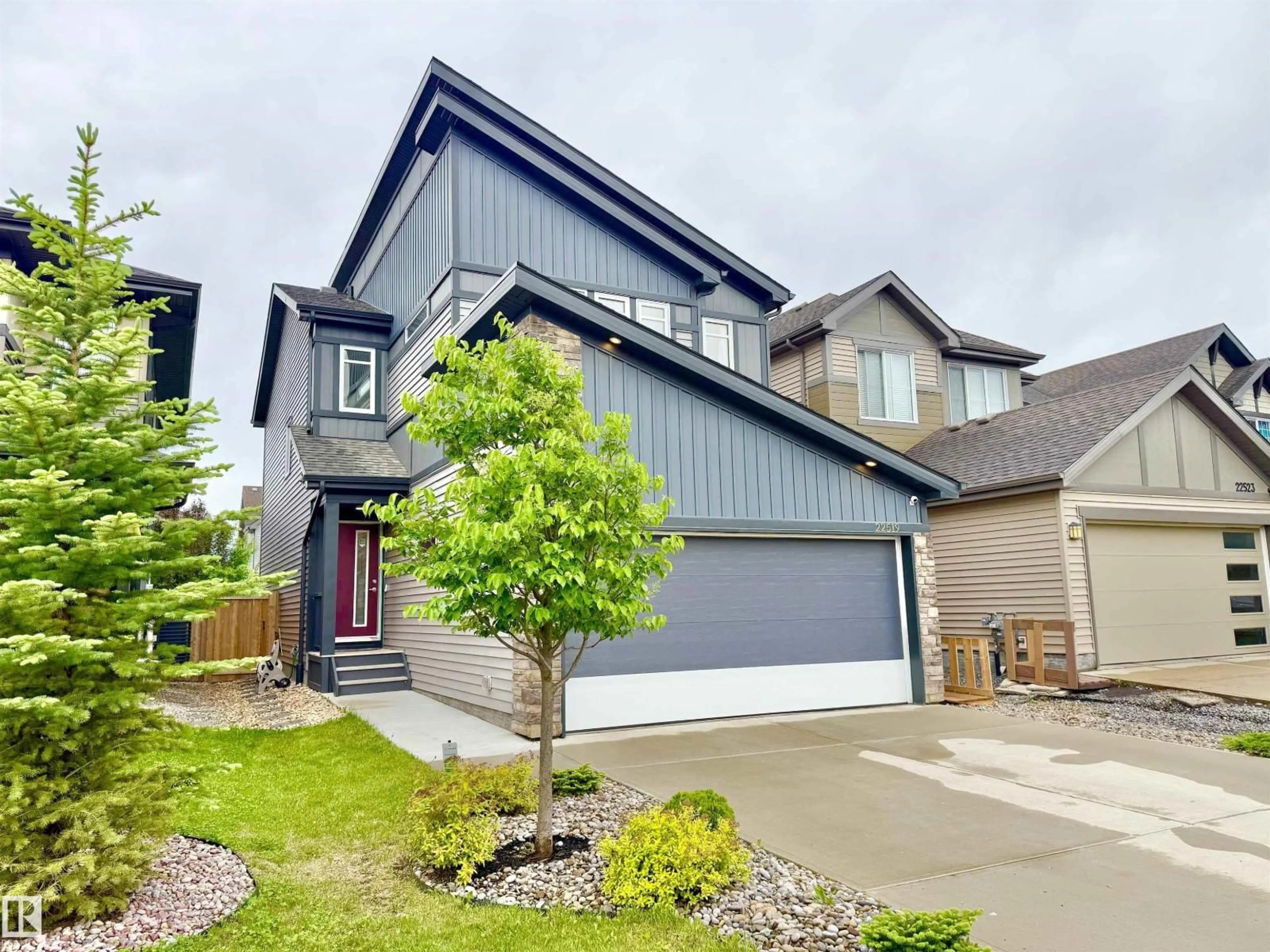Home with vinyl exterior material, street for NW - 22519 96 AV, Edmonton Alberta T5T7K5