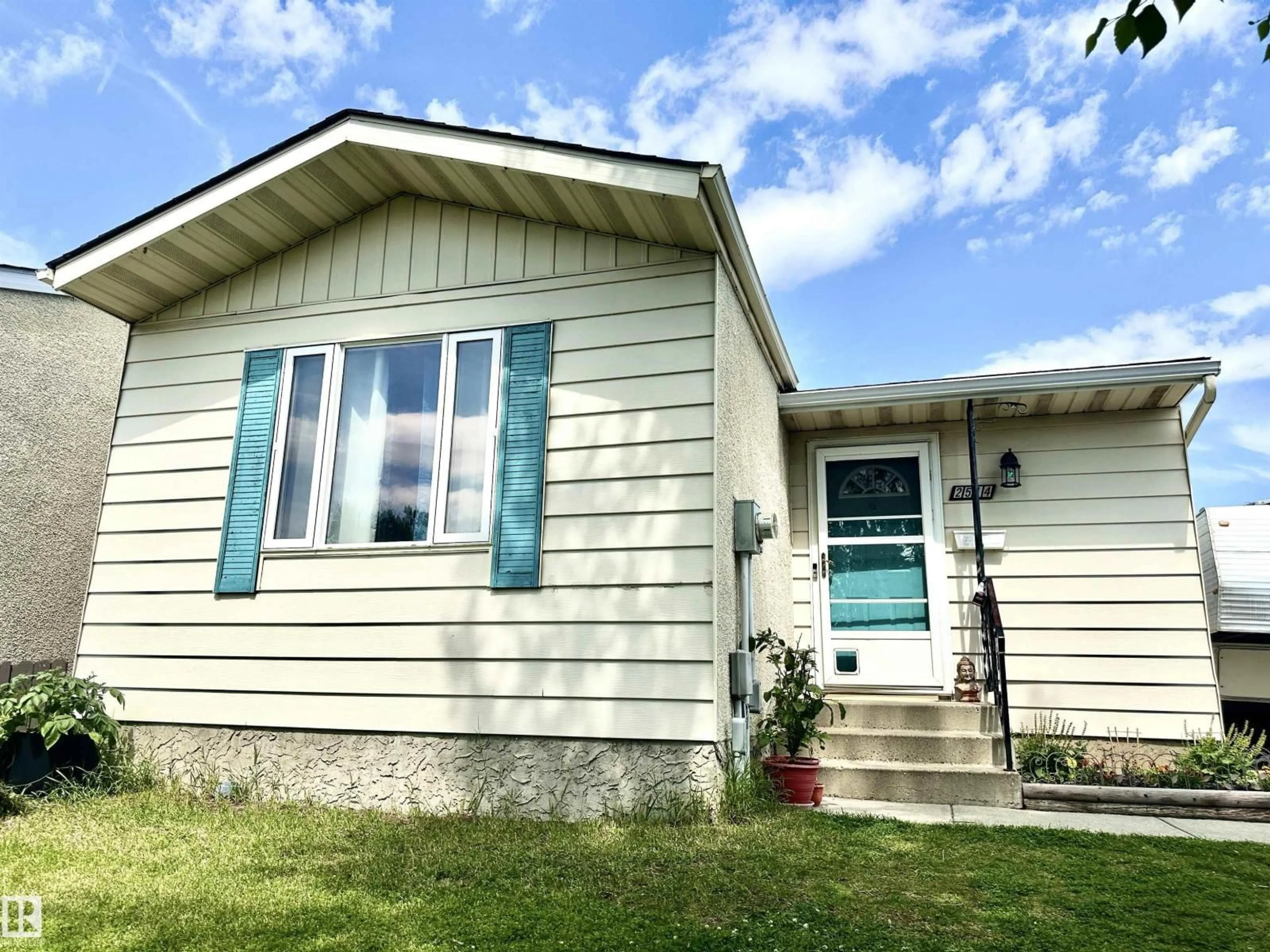Home with vinyl exterior material, street for NW - 2514 149 AV, Edmonton Alberta T5Y1X3