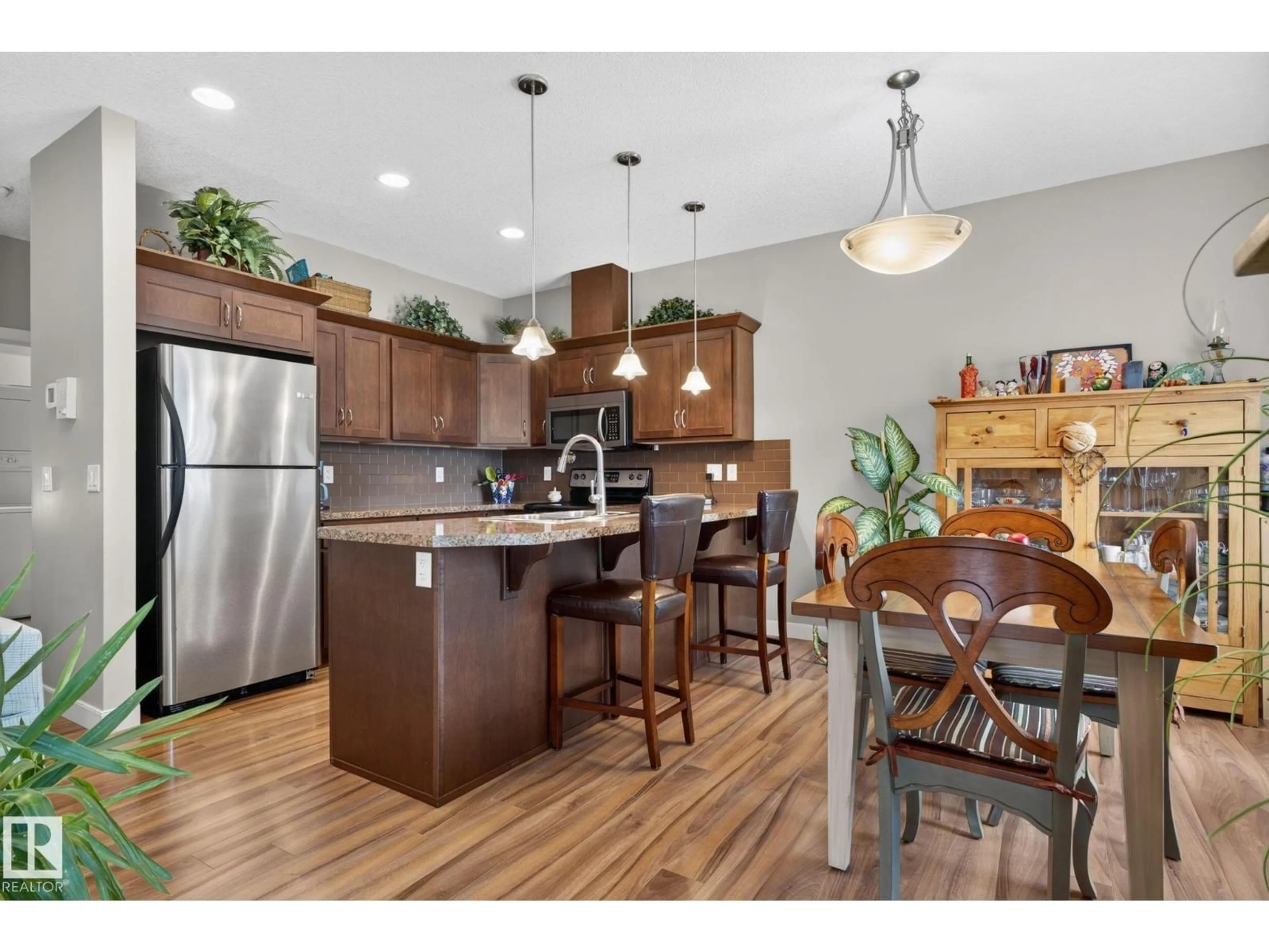 Open concept kitchen, wood/laminate floor for #91 - 7293 SOUTH TERWILLEGAR DR, Edmonton Alberta T6R0N5