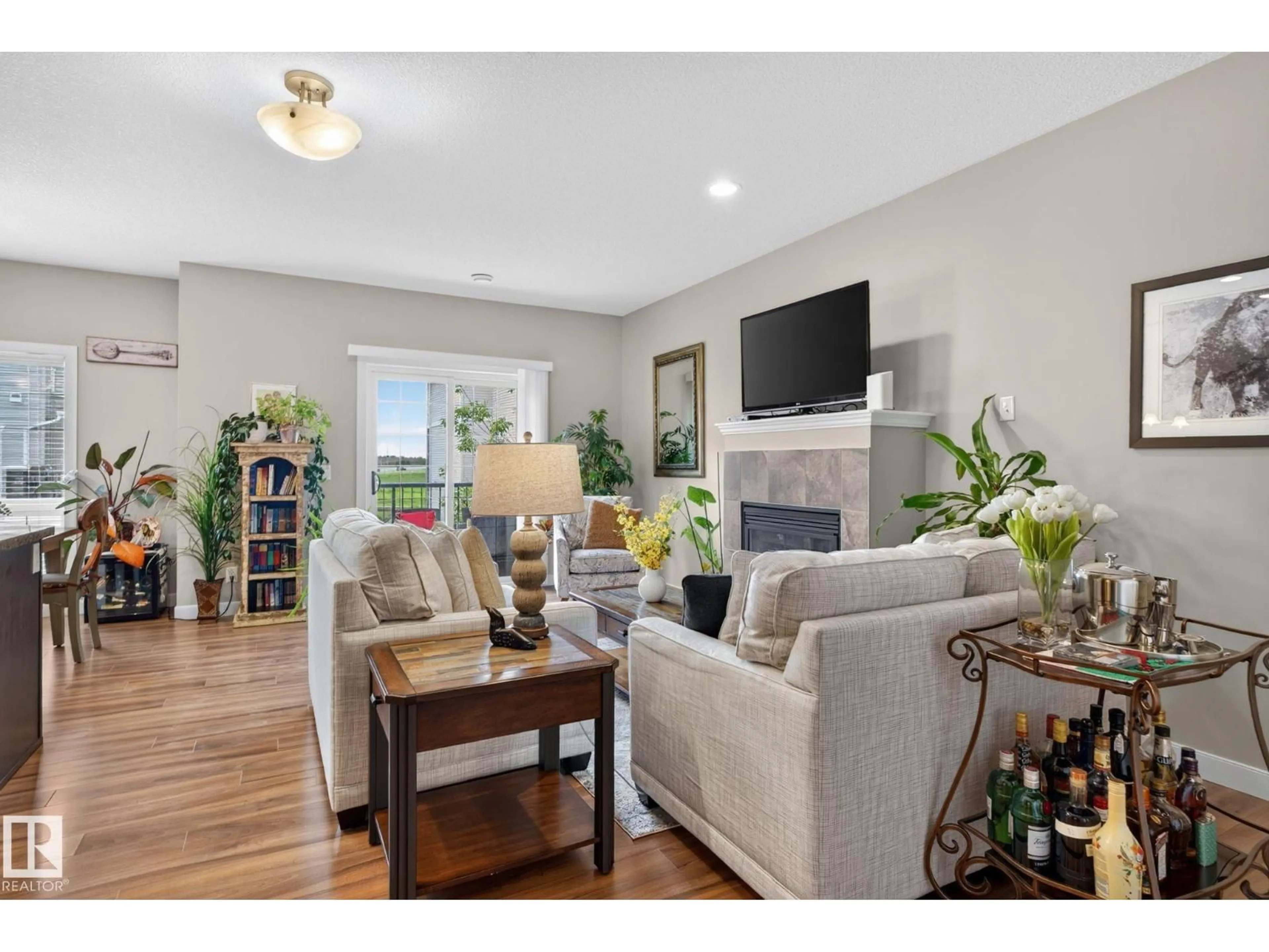 Living room with furniture, wood/laminate floor for #91 - 7293 SOUTH TERWILLEGAR DR, Edmonton Alberta T6R0N5