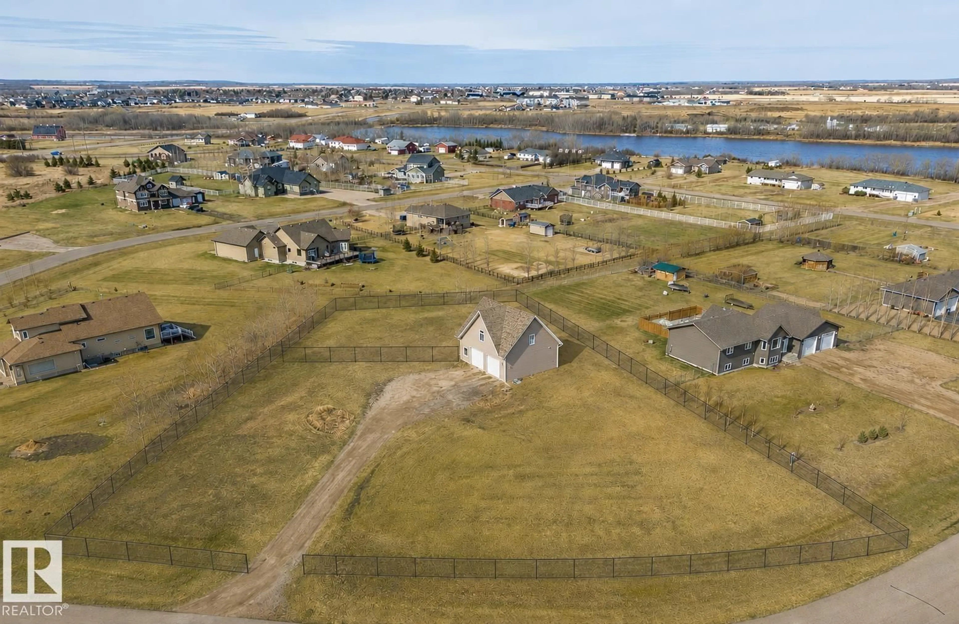 A pic from outside/outdoor area/front of a property/back of a property/a pic from drone, water/lake/river/ocean view for 124 45326 HIGHWAY HIGHWAY, Rural Bonnyville M.D. Alberta T9N2J6