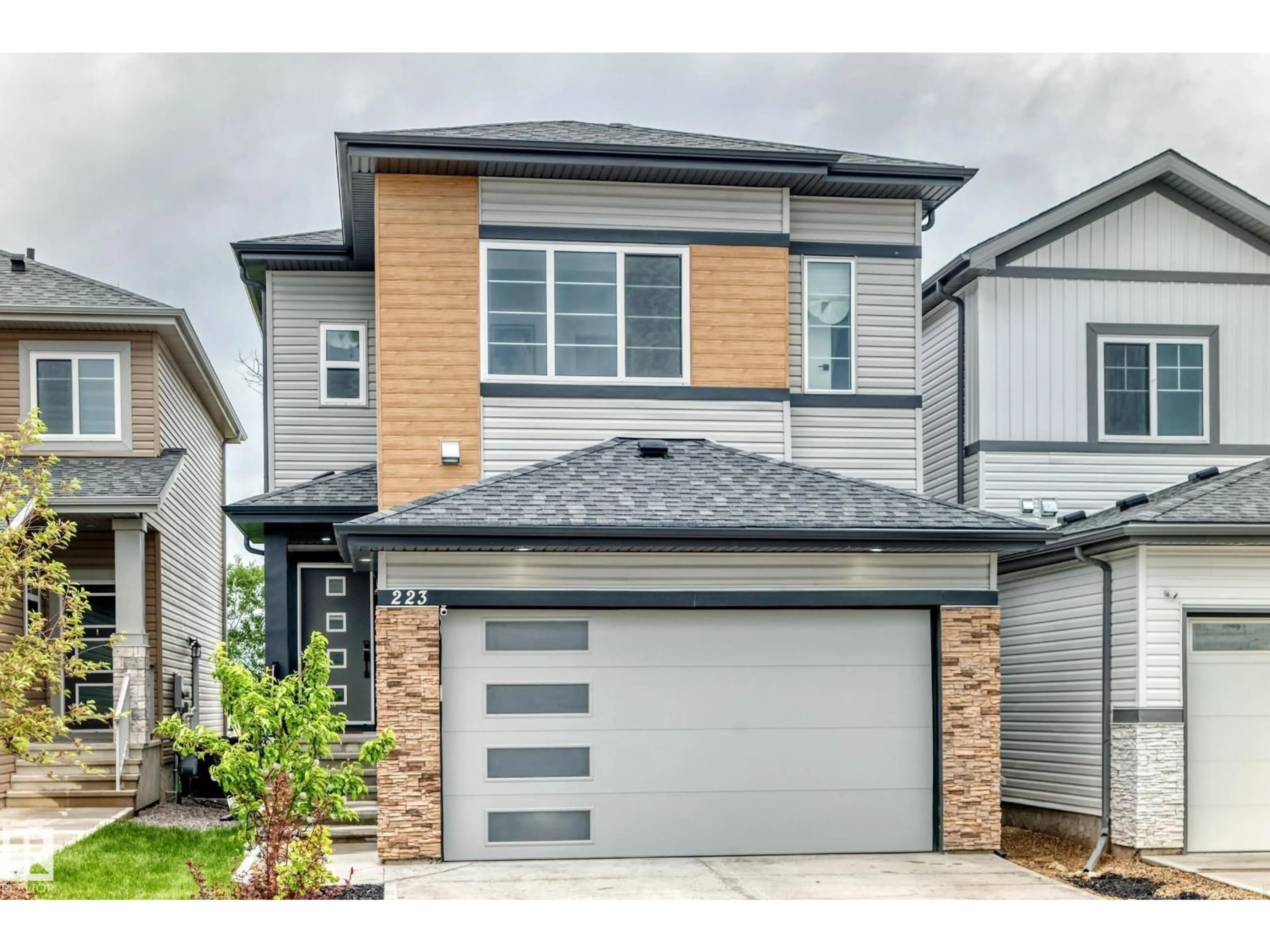 Home with vinyl exterior material, street for 223 ROLSTON WD, Leduc Alberta T9E1N1