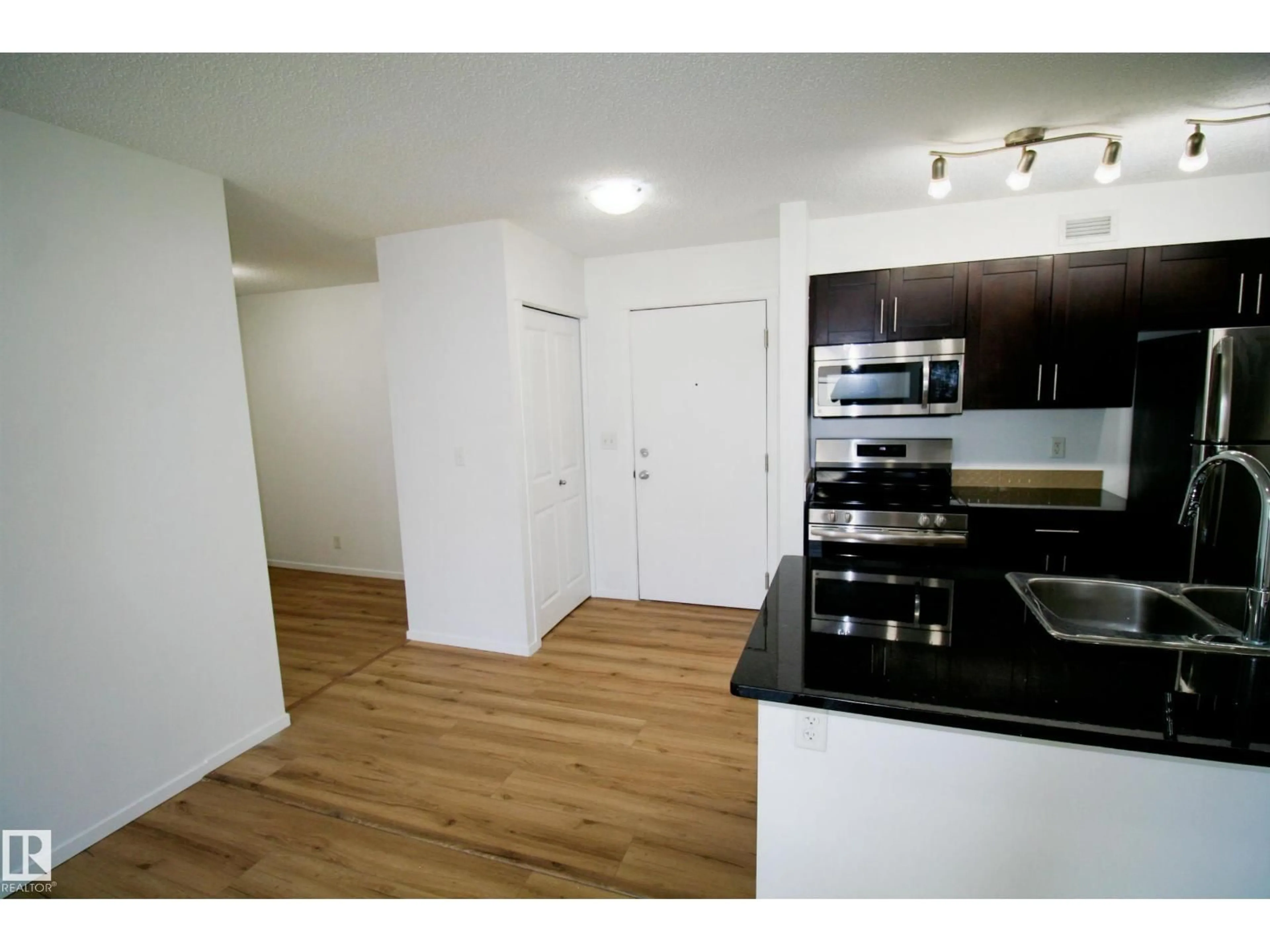 Standard kitchen, wood/laminate floor for #417 - 5804 MULLEN PL, Edmonton Alberta T6R0W3