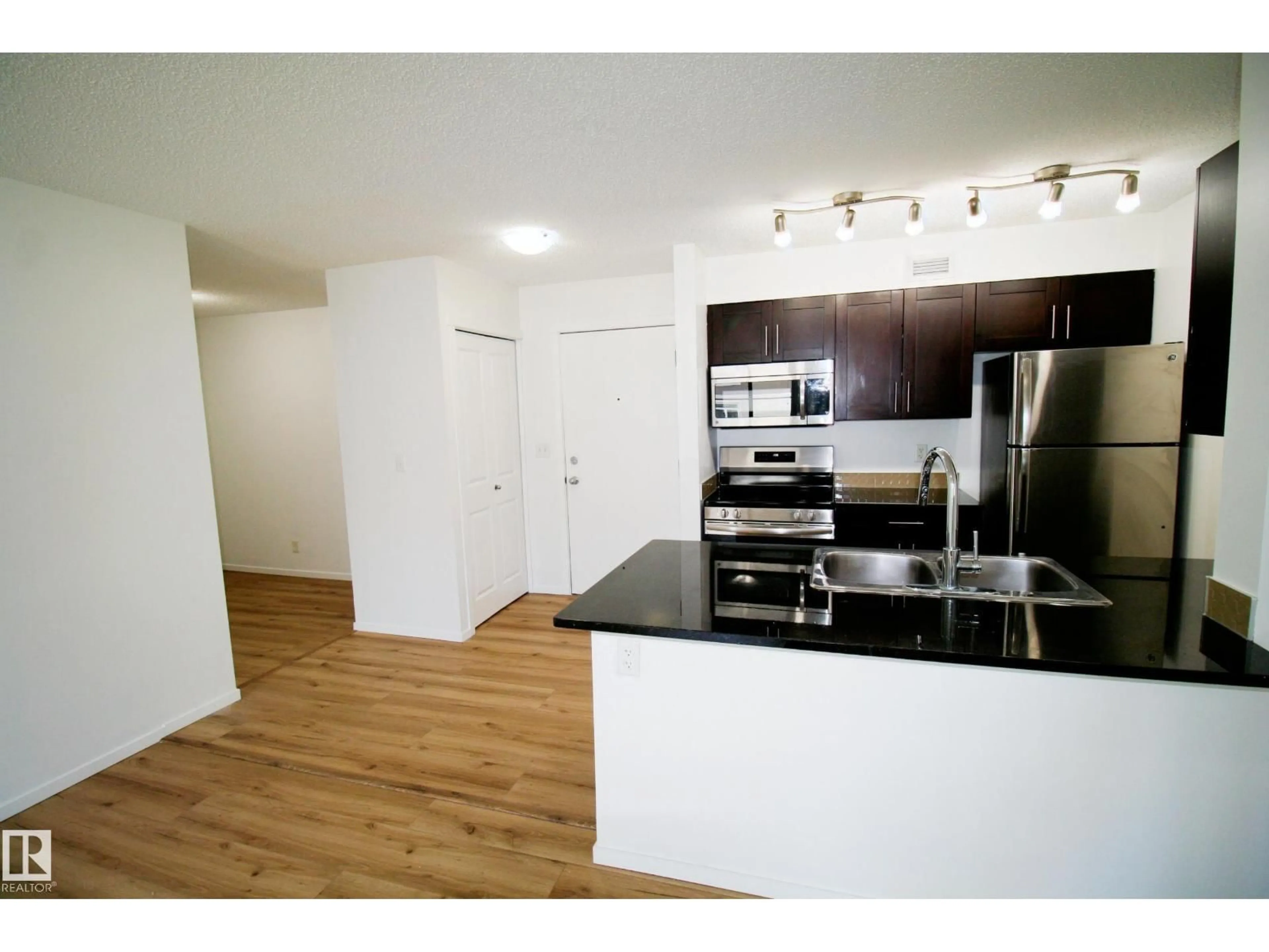 Standard kitchen, wood/laminate floor for #417 - 5804 MULLEN PL, Edmonton Alberta T6R0W3