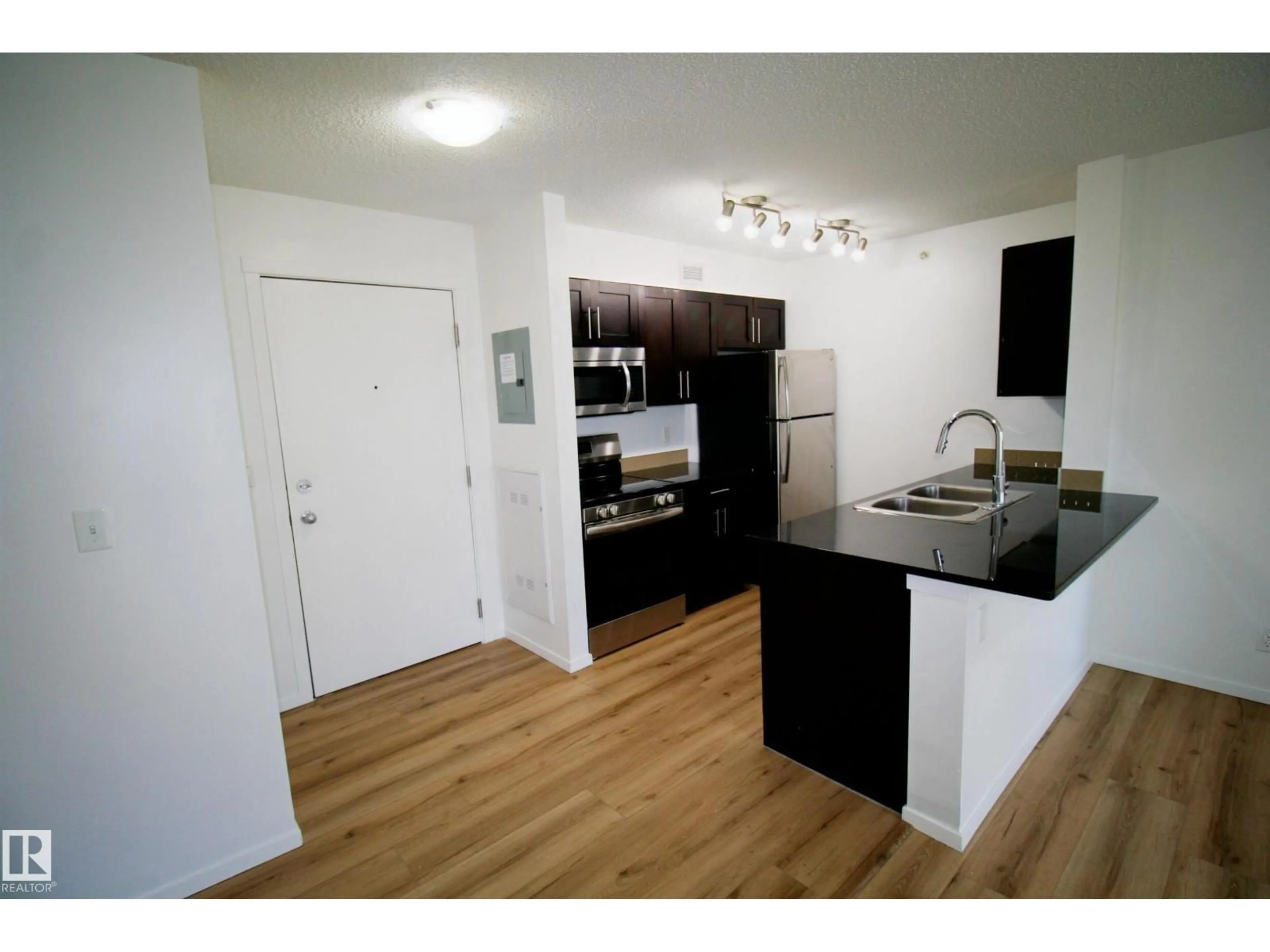 Standard kitchen, wood/laminate floor for #417 - 5804 MULLEN PL, Edmonton Alberta T6R0W3