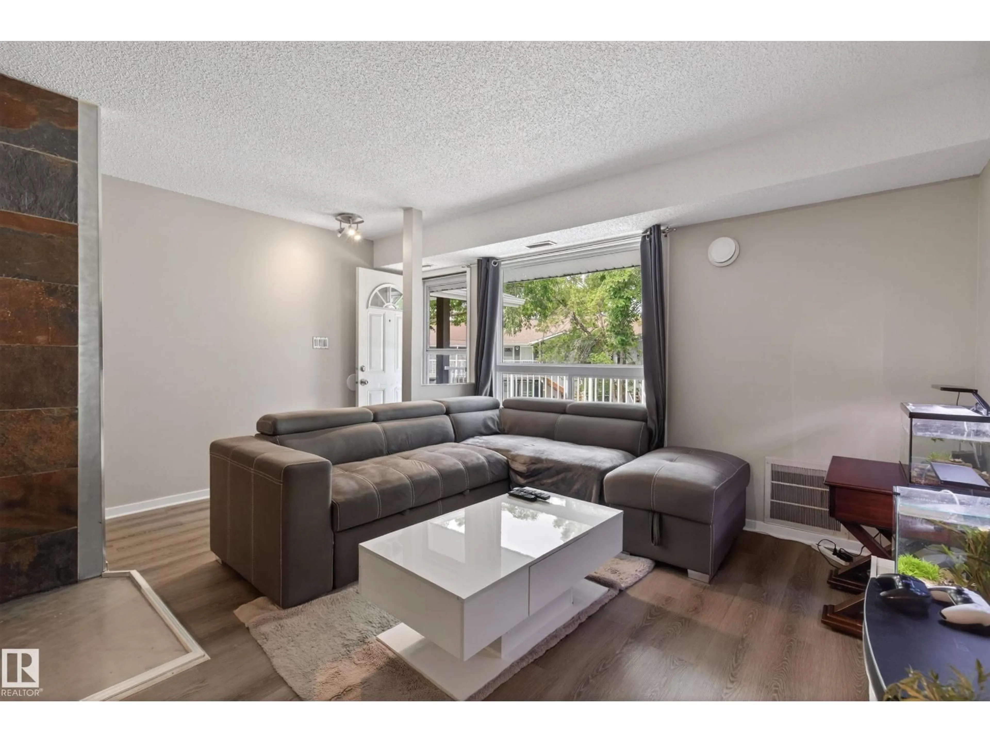 Living room with furniture, unknown for 35 - 3111 142 AV NW, Edmonton Alberta T5Y2H6