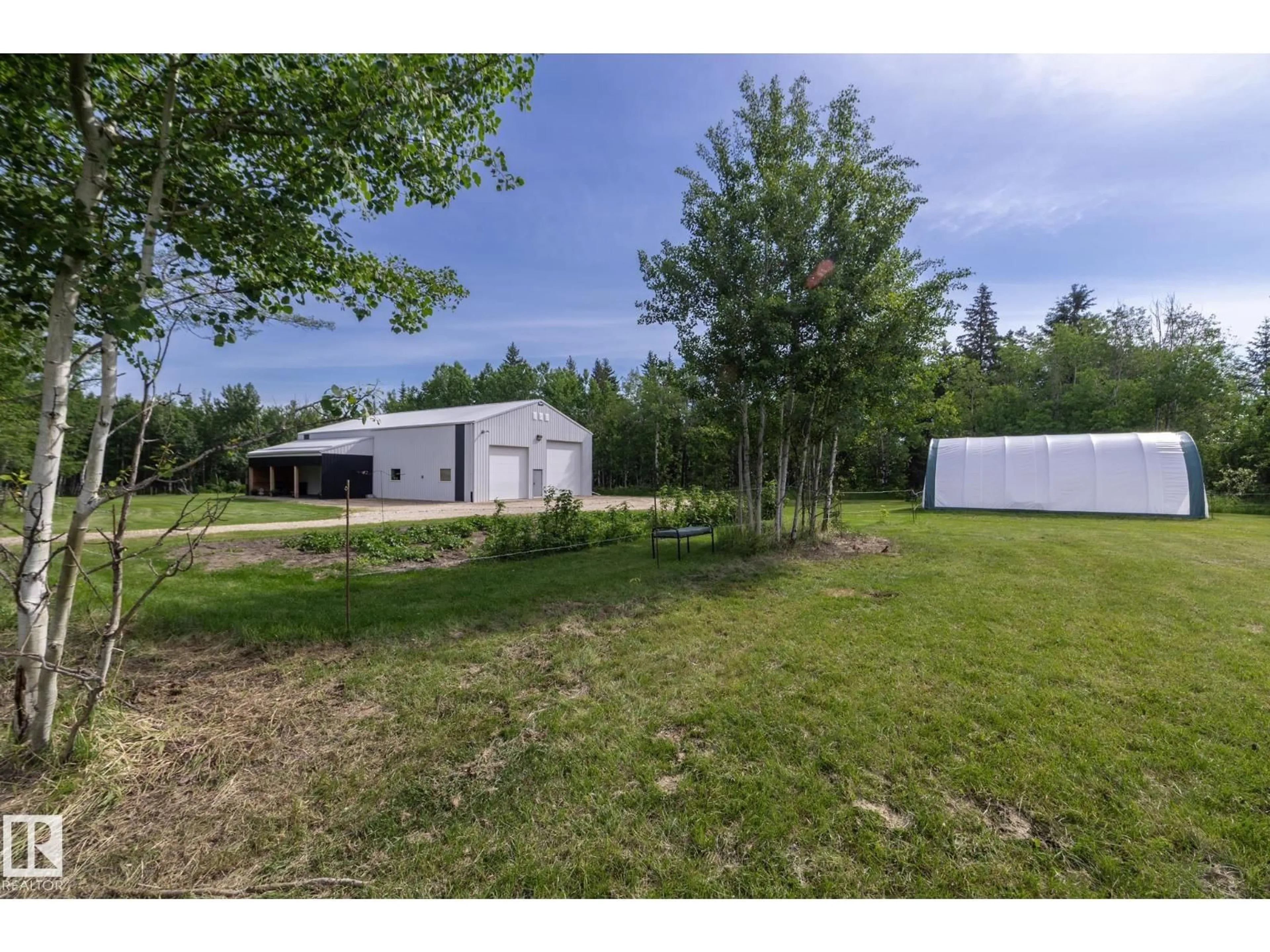 A pic from outside/outdoor area/front of a property/back of a property/a pic from drone, forest/trees view for 57511 RANGE 92 RD, Rural Lac Ste. Anne County Alberta T0E1N0
