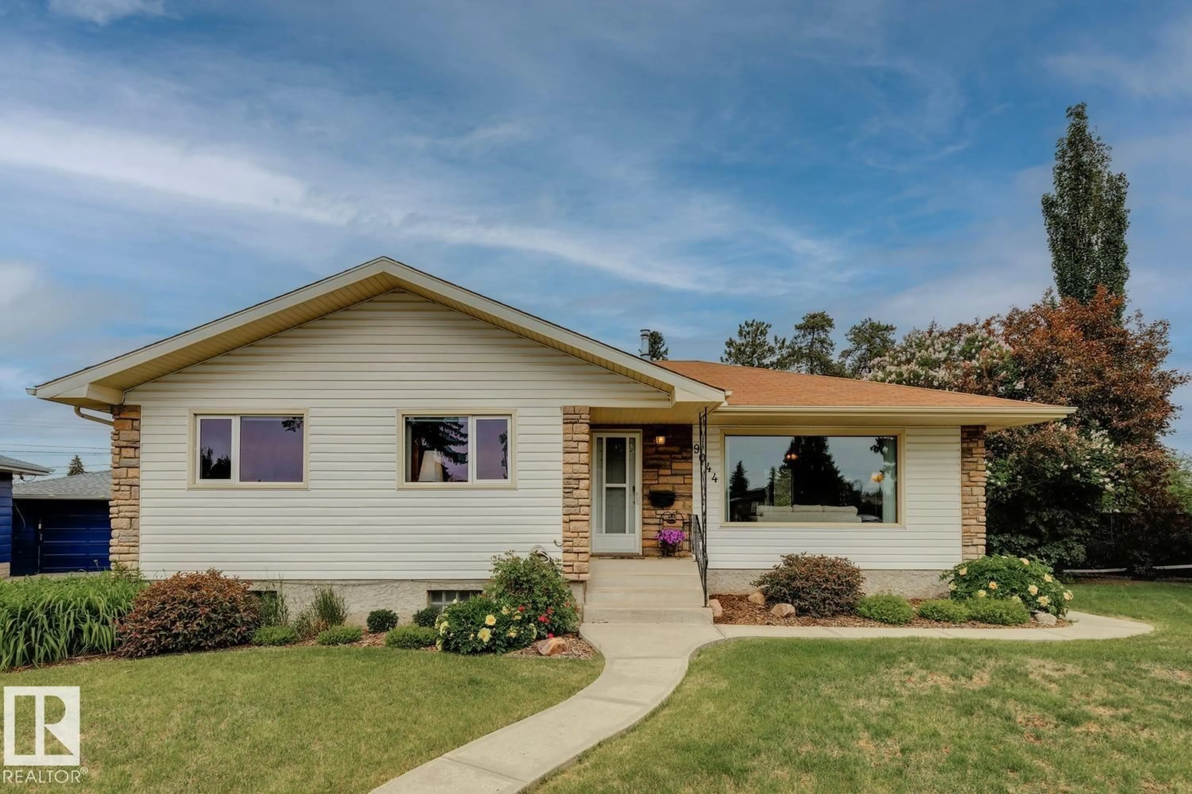 Home with vinyl exterior material, street for 9044 56 ST, Edmonton Alberta T6B1J2