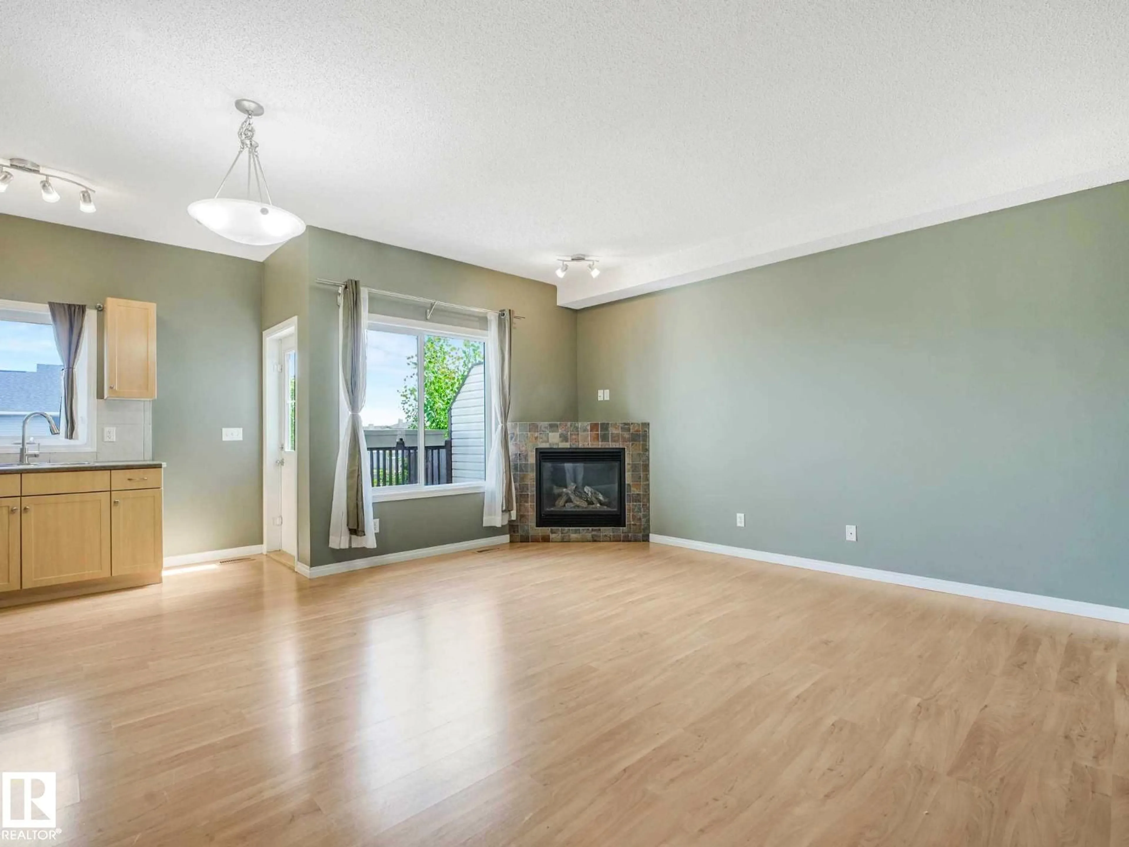 Living room with furniture, wood/laminate floor for 69 171 BRINTNELL BV, Edmonton Alberta T5Y0C6