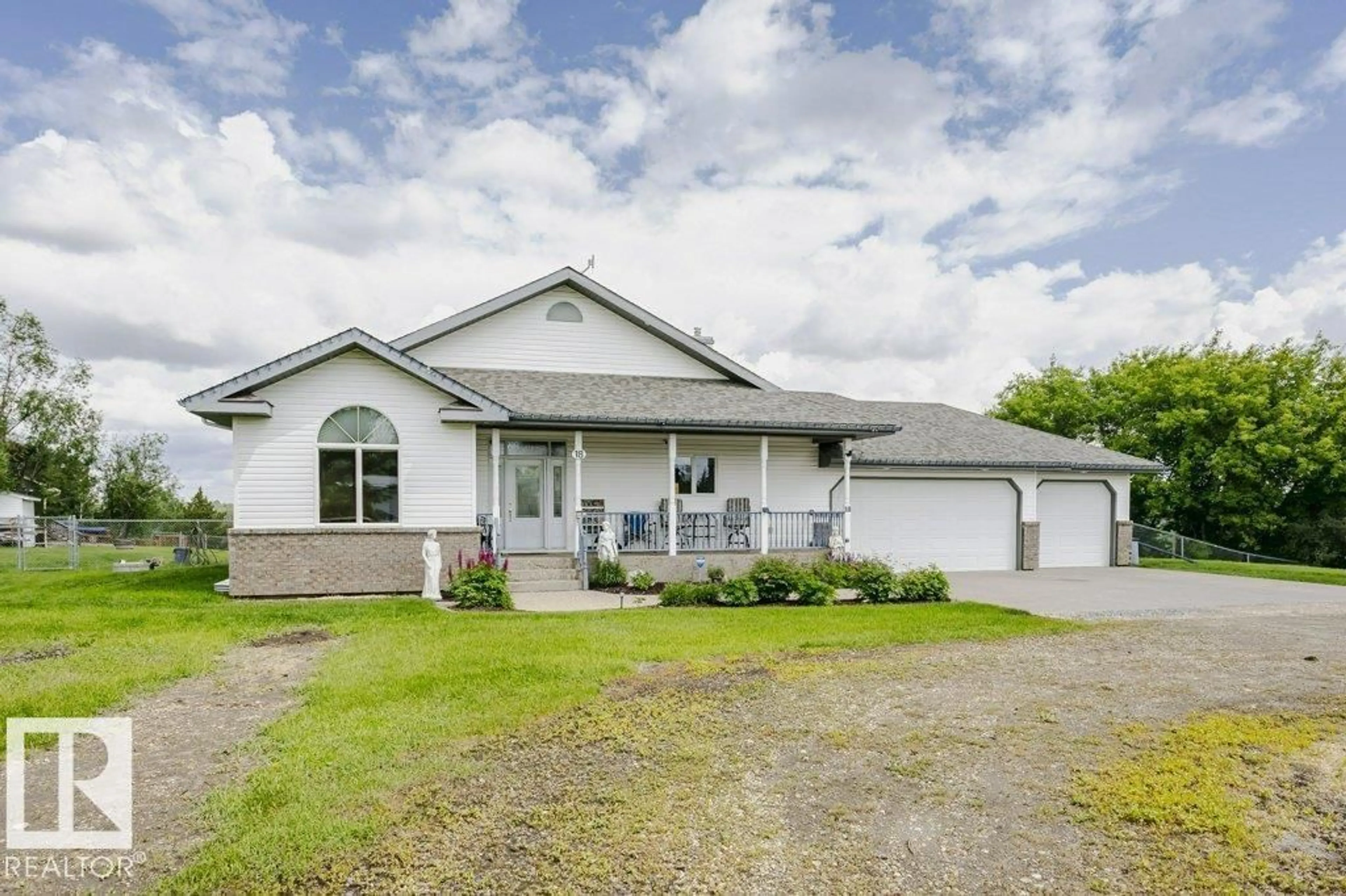 Home with vinyl exterior material, street for 18 - 56019 RGE ROAD 230, Rural Sturgeon County Alberta T0A1N0