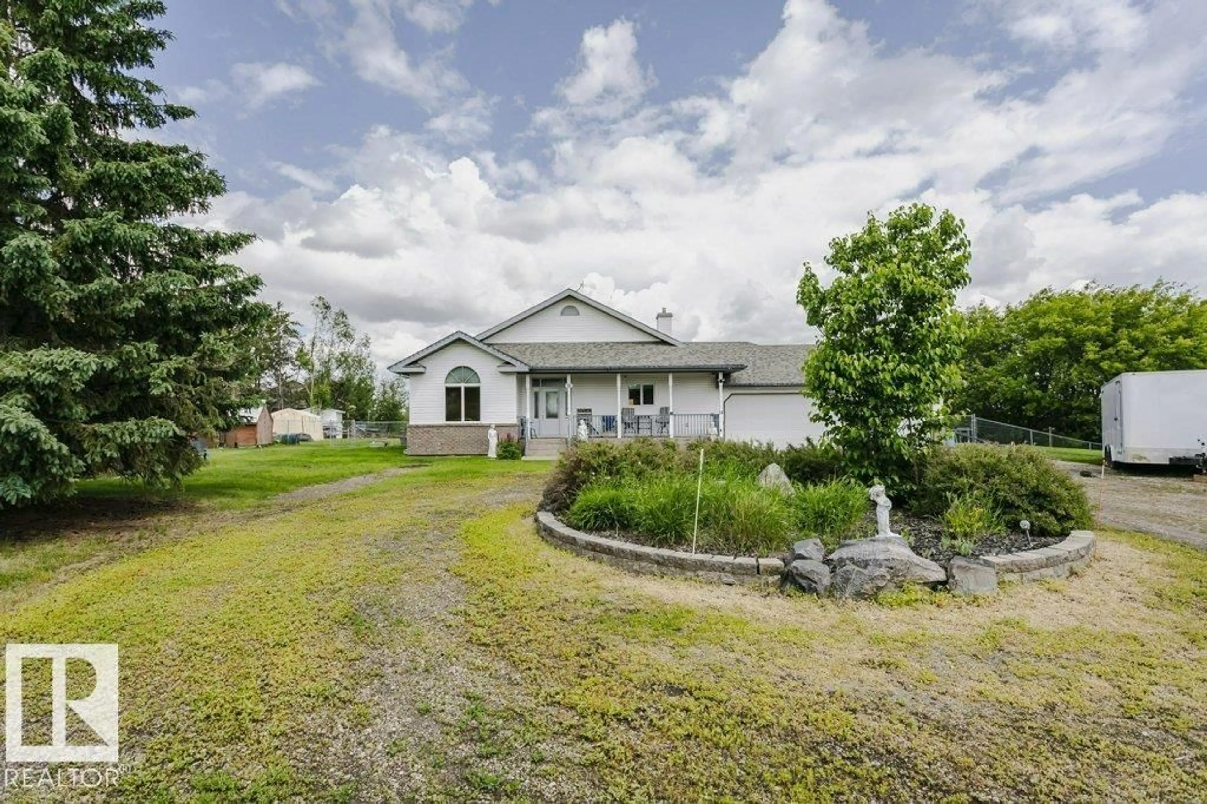 A pic from outside/outdoor area/front of a property/back of a property/a pic from drone, water/lake/river/ocean view for 18 - 56019 RGE ROAD 230, Rural Sturgeon County Alberta T0A1N0