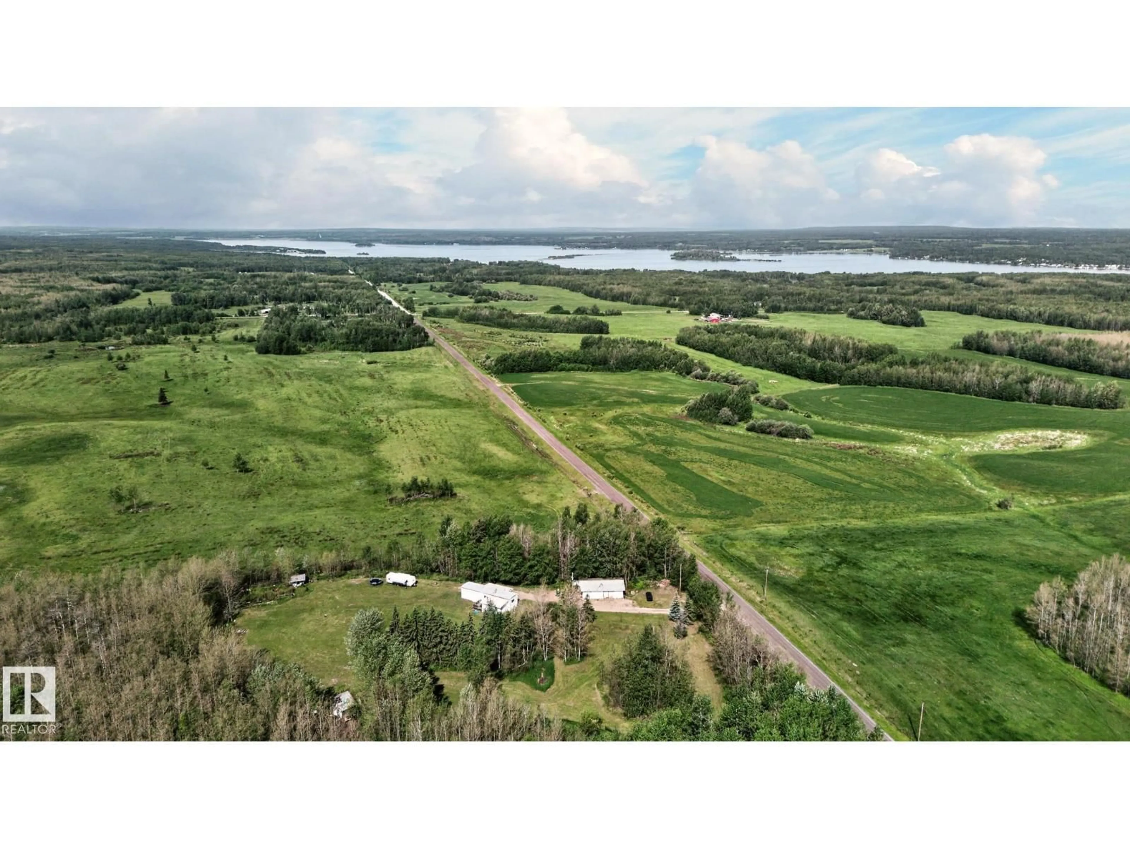 A pic from outside/outdoor area/front of a property/back of a property/a pic from drone, water/lake/river/ocean view for 5115 TWP ROAD 540, Rural Lac Ste. Anne County Alberta T0E0V0