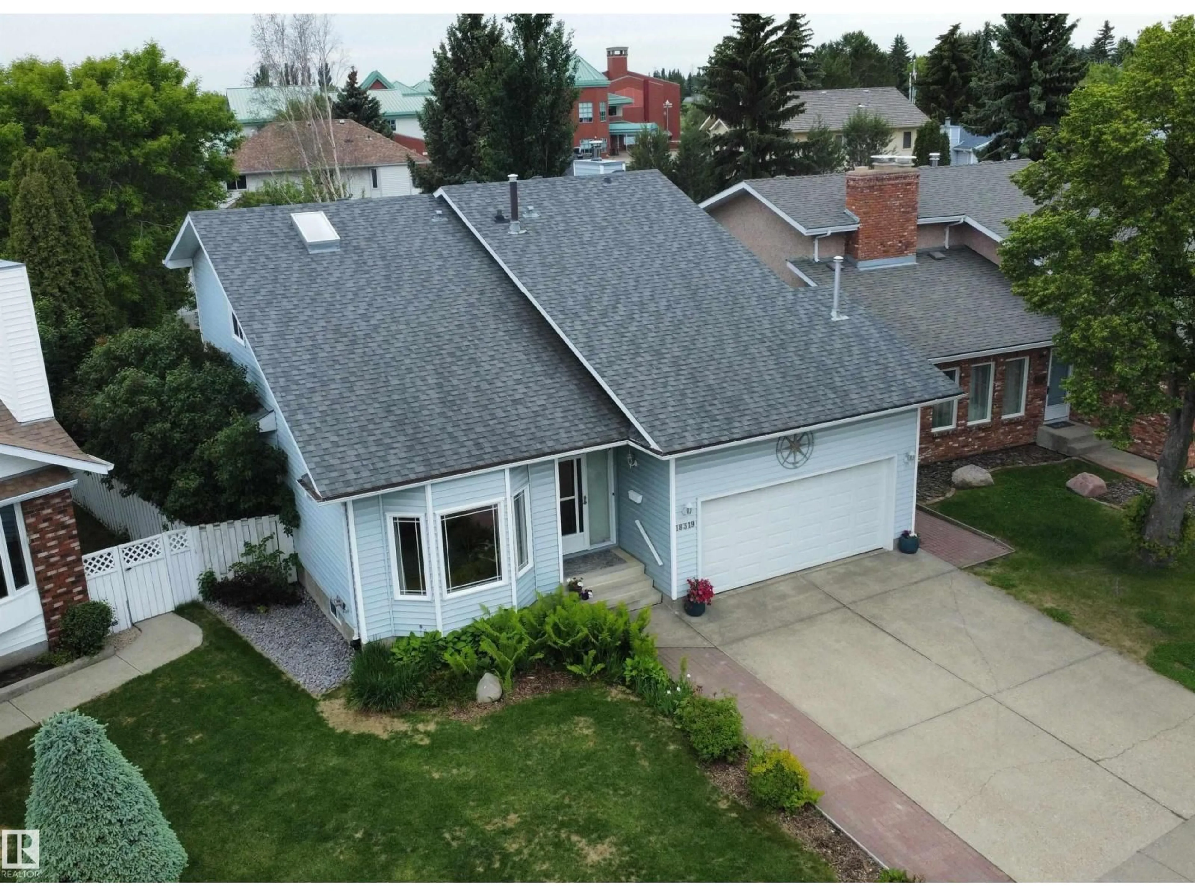 A pic from outside/outdoor area/front of a property/back of a property/a pic from drone, street for 18319 58 AV, Edmonton Alberta T6M1V9