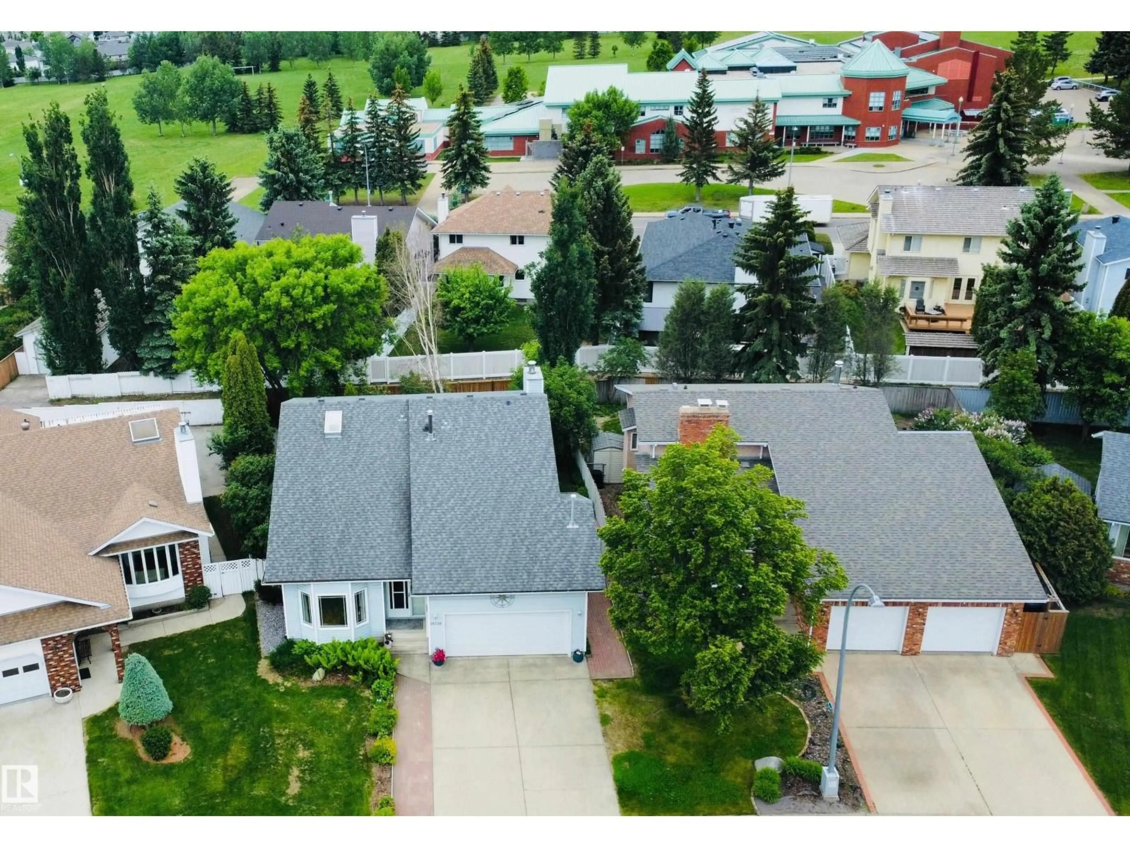 A pic from outside/outdoor area/front of a property/back of a property/a pic from drone, street for 18319 58 AV, Edmonton Alberta T6M1V9