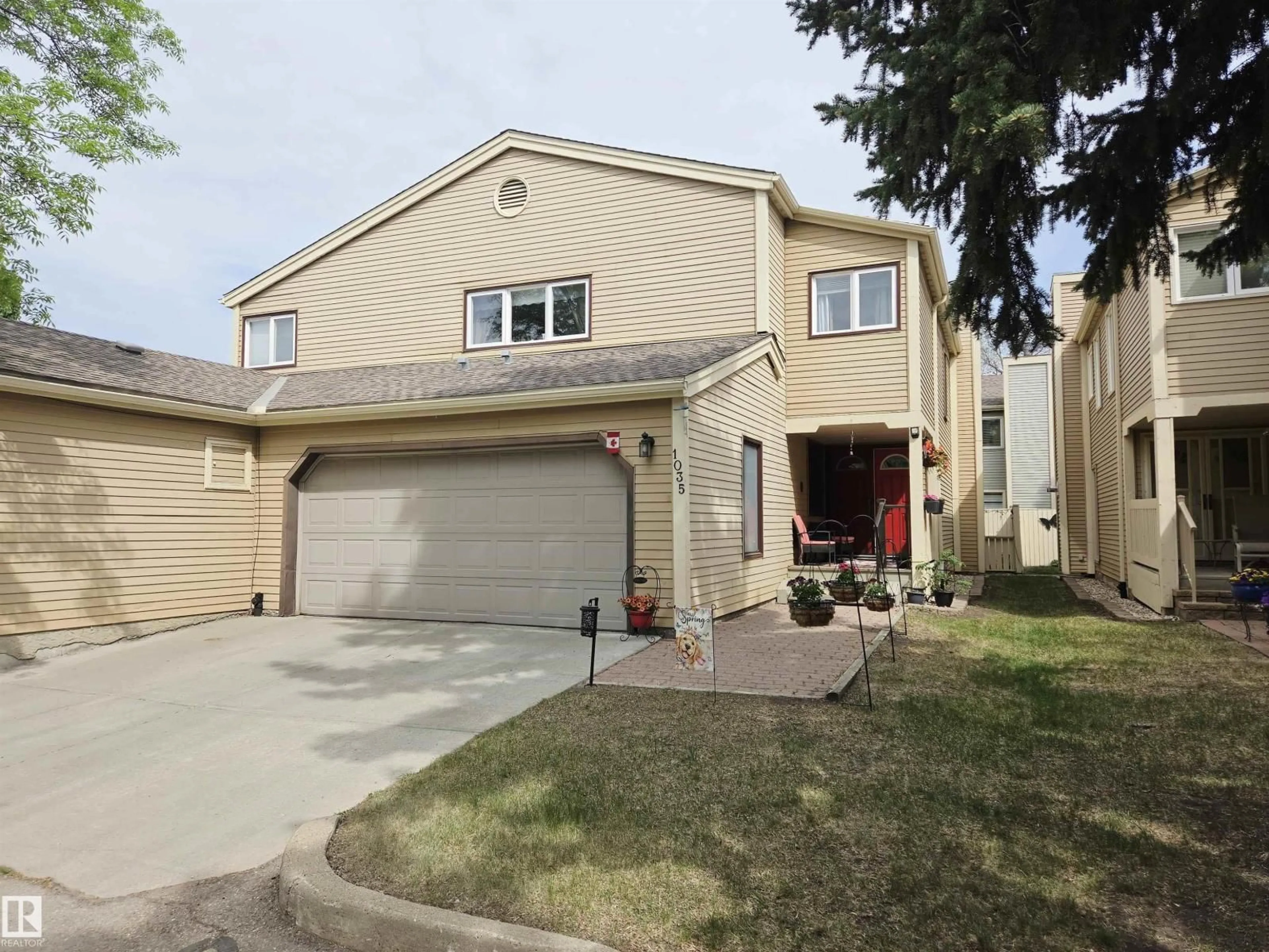 Home with vinyl exterior material, street for NW - 1035 109 ST, Edmonton Alberta T6J5G2
