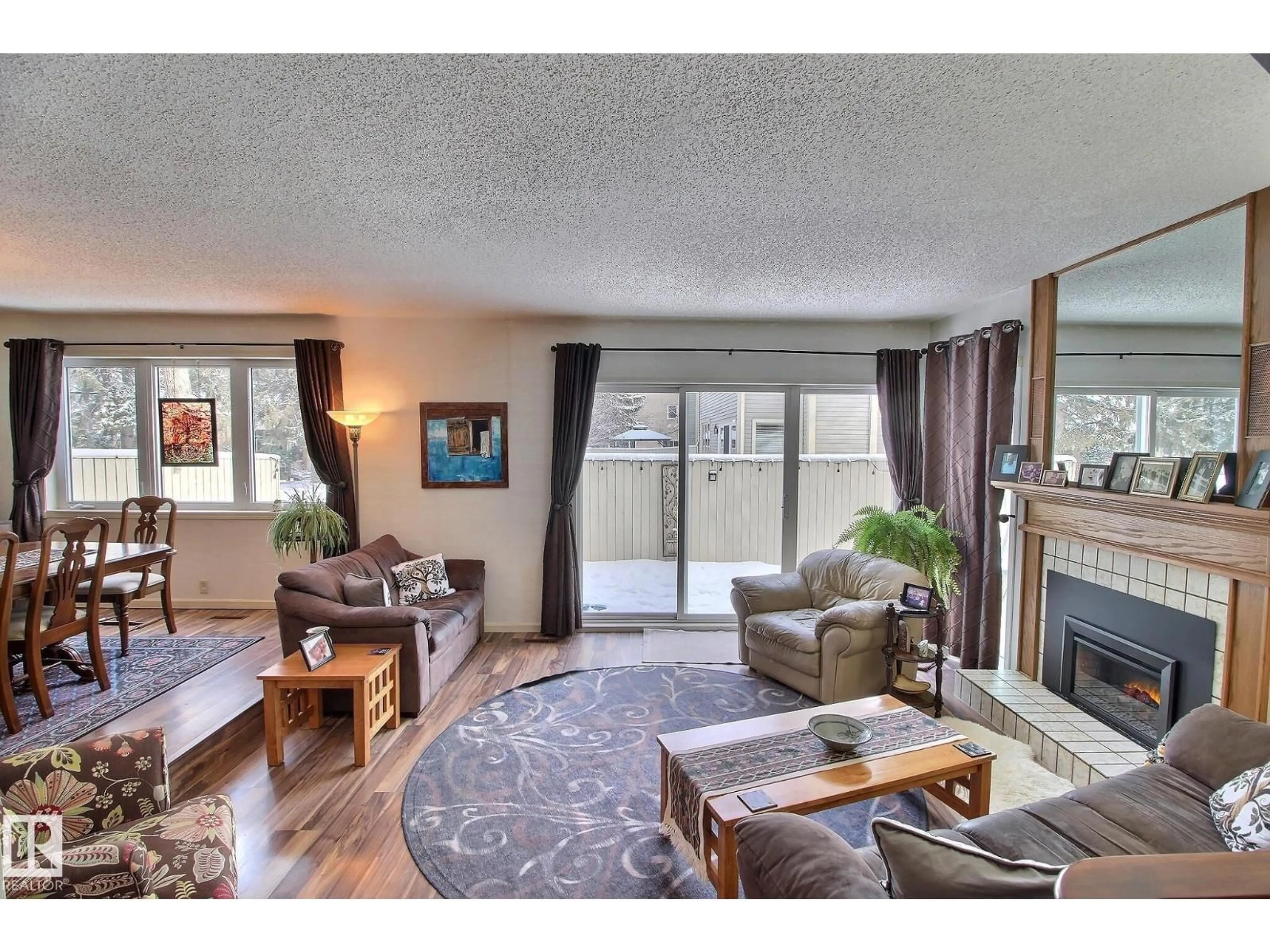 Living room with furniture, wood/laminate floor for NW - 1035 109 ST, Edmonton Alberta T6J5G2