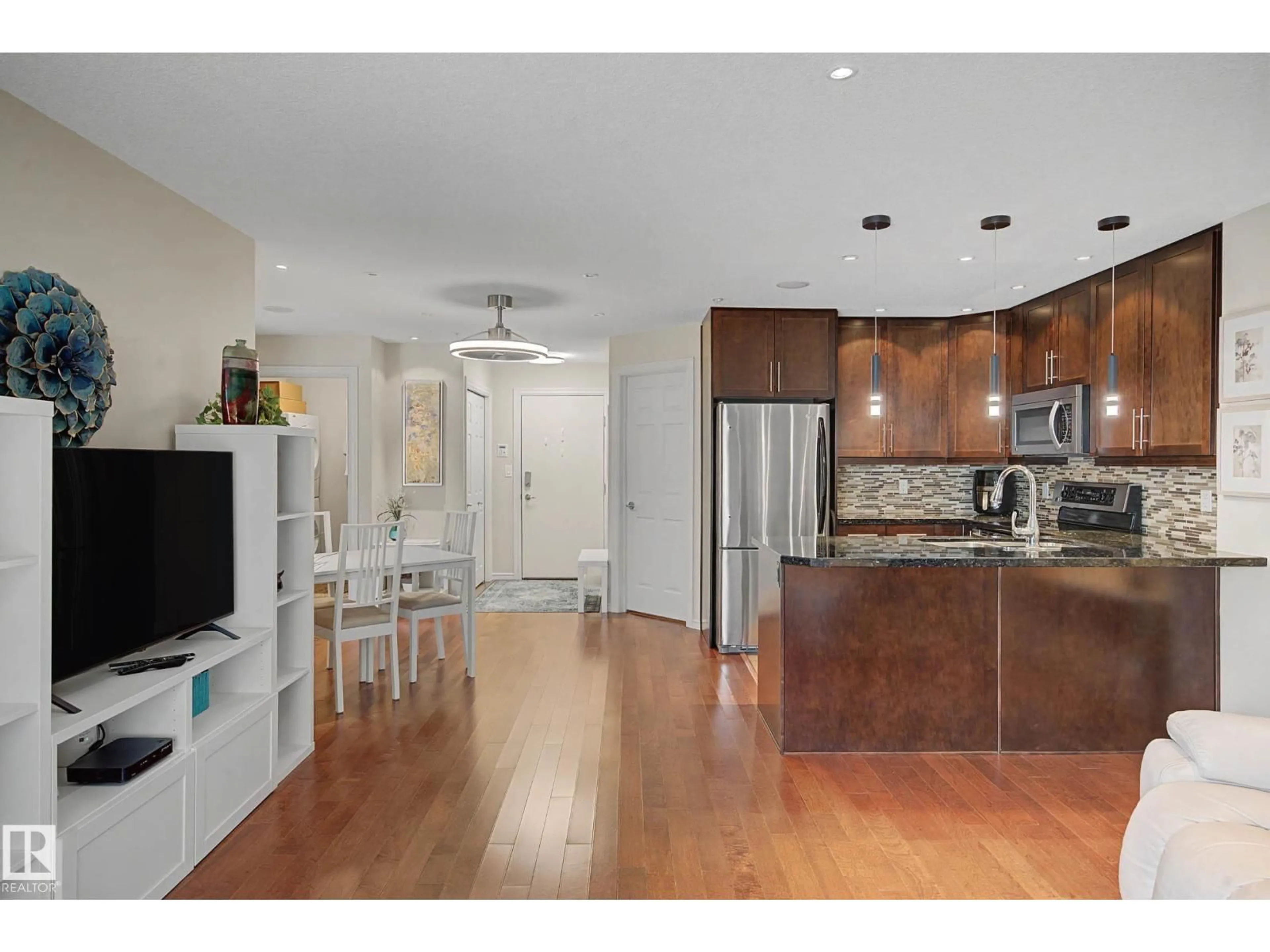 Open concept kitchen, wood/laminate floor for 210 - 2204 44 AV, Edmonton Alberta T6T0G5