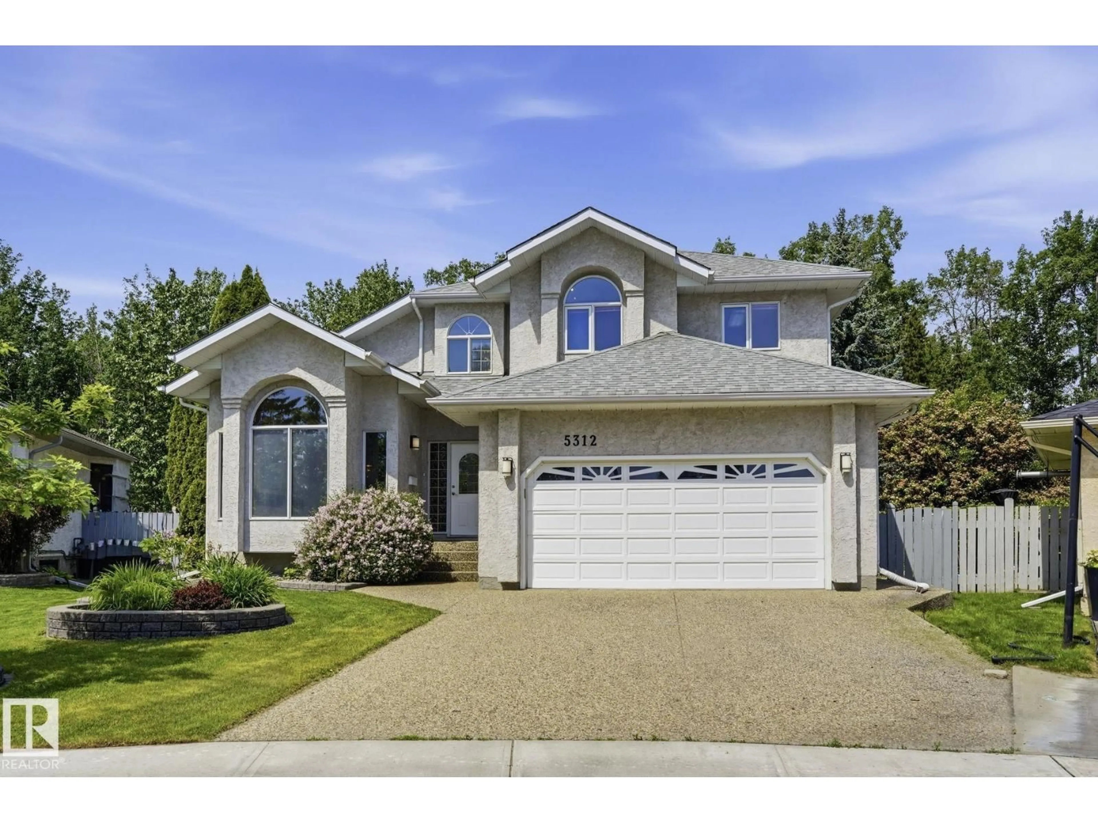 Home with vinyl exterior material, street for 5312 187 ST, Edmonton Alberta T6M2K5