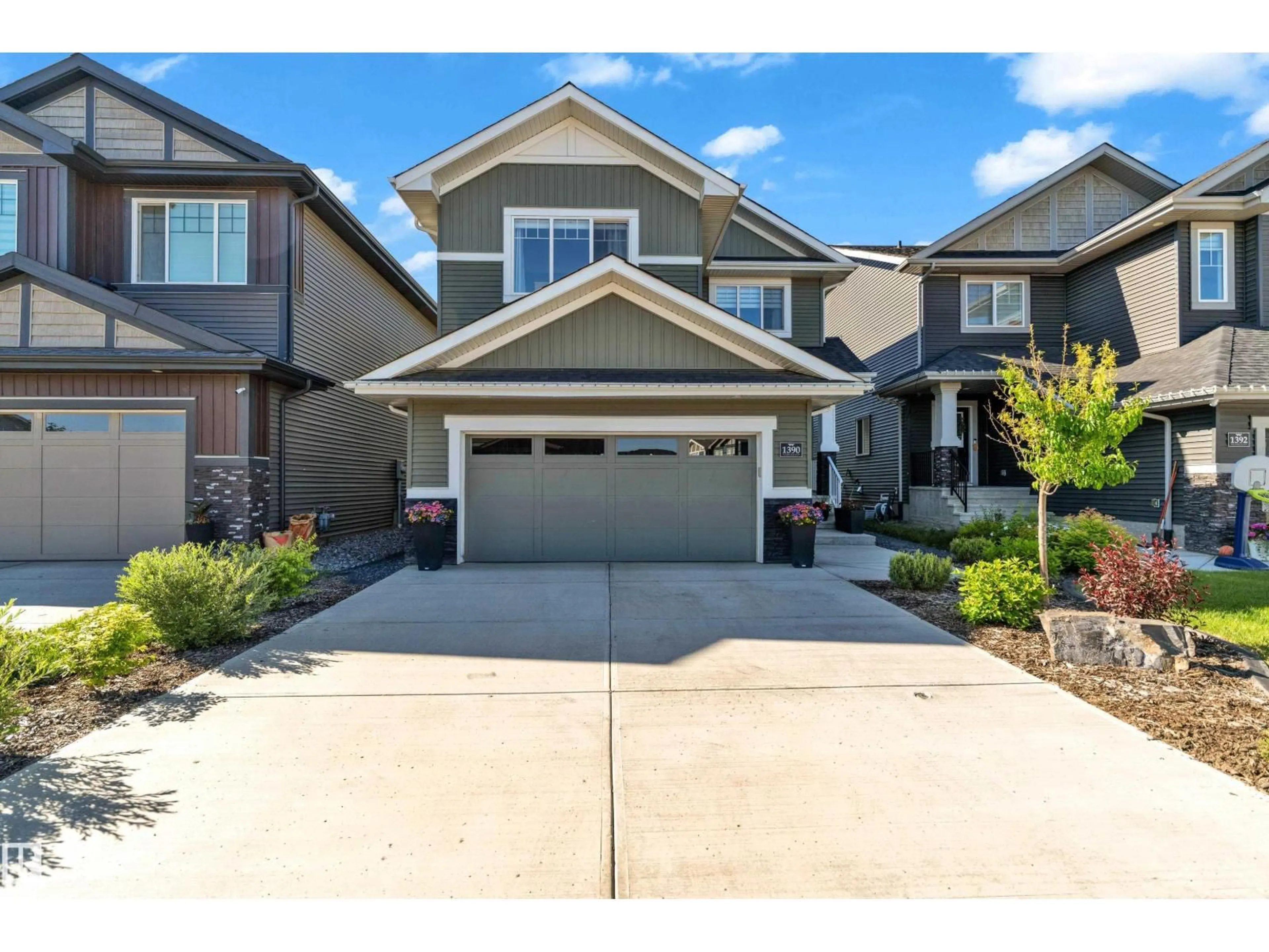 Home with vinyl exterior material, street for 1390 ENRIGHT LD, Edmonton Alberta T6M0Z1