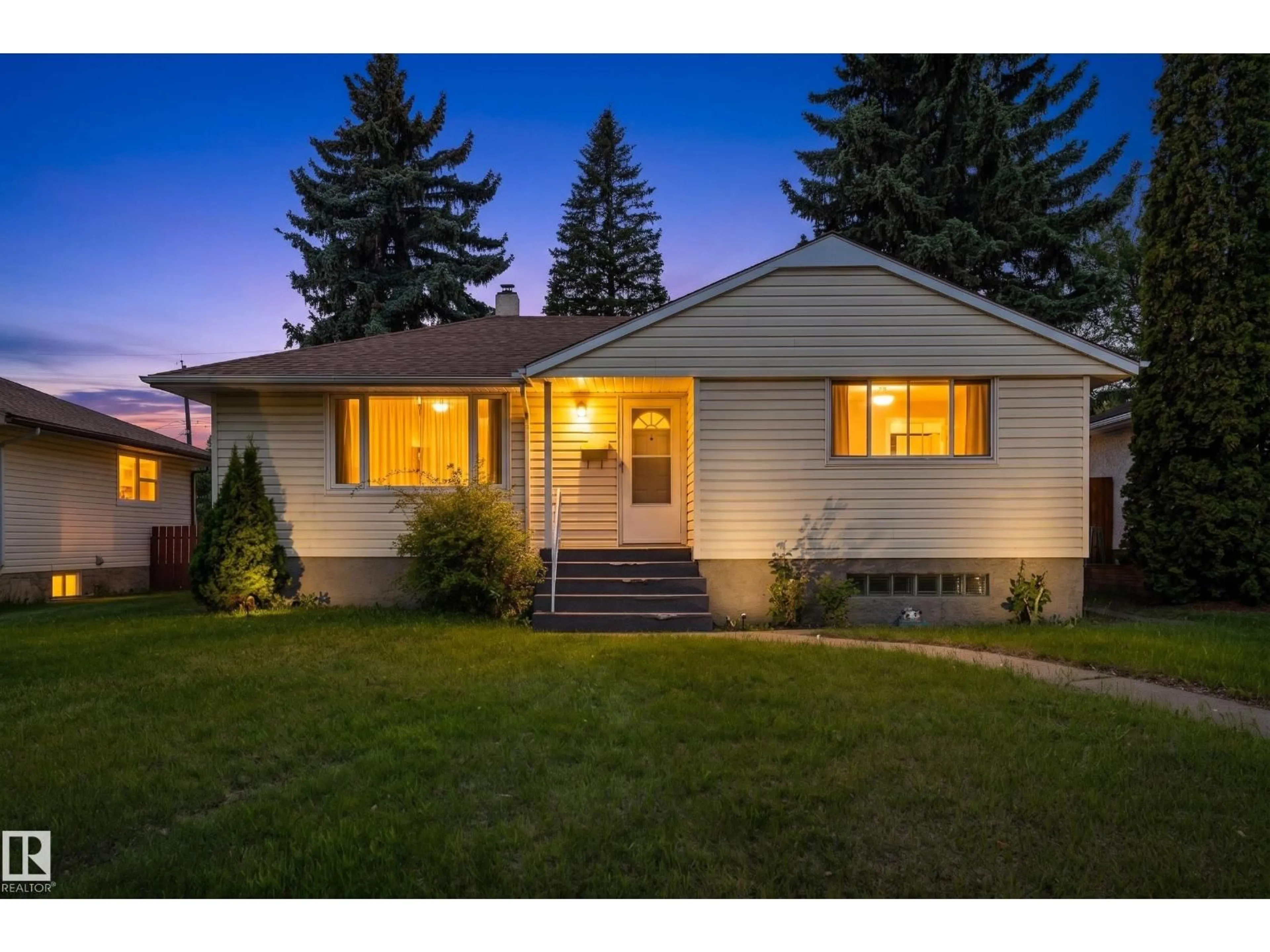 Home with vinyl exterior material, street for 12228 141 ST NW, Edmonton Alberta T5L2G2