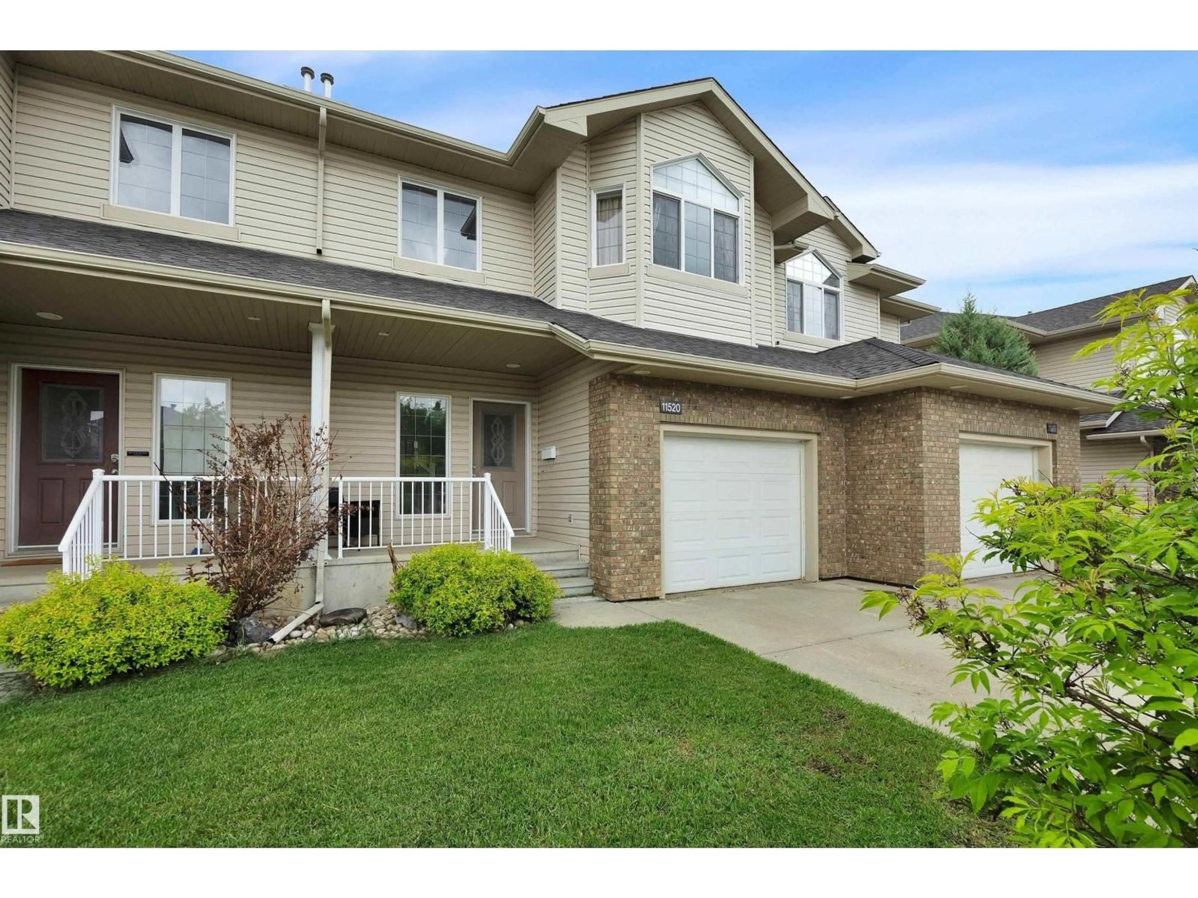 Home with vinyl exterior material, street for 11520 11 AV, Edmonton Alberta T6W1W7