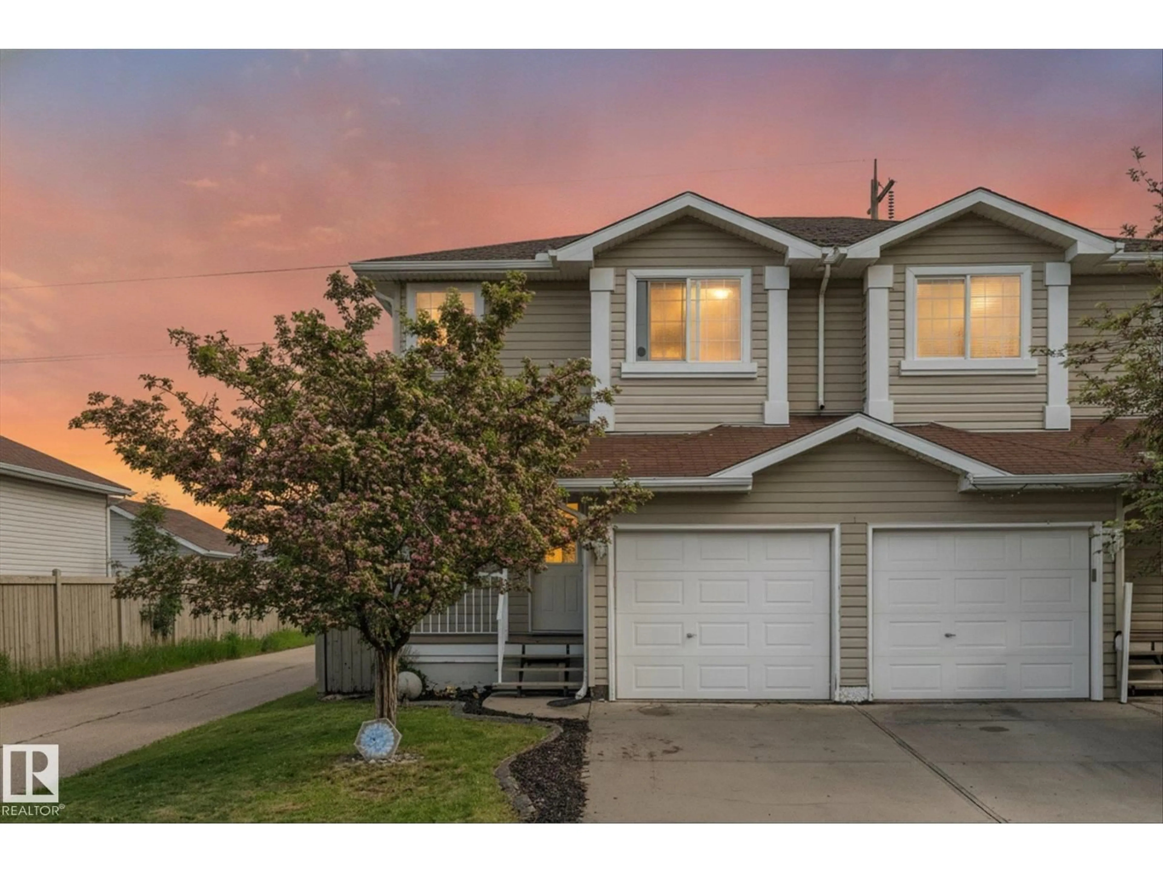 Home with vinyl exterior material, street for 2324 30 AV, Edmonton Alberta T6T2B3