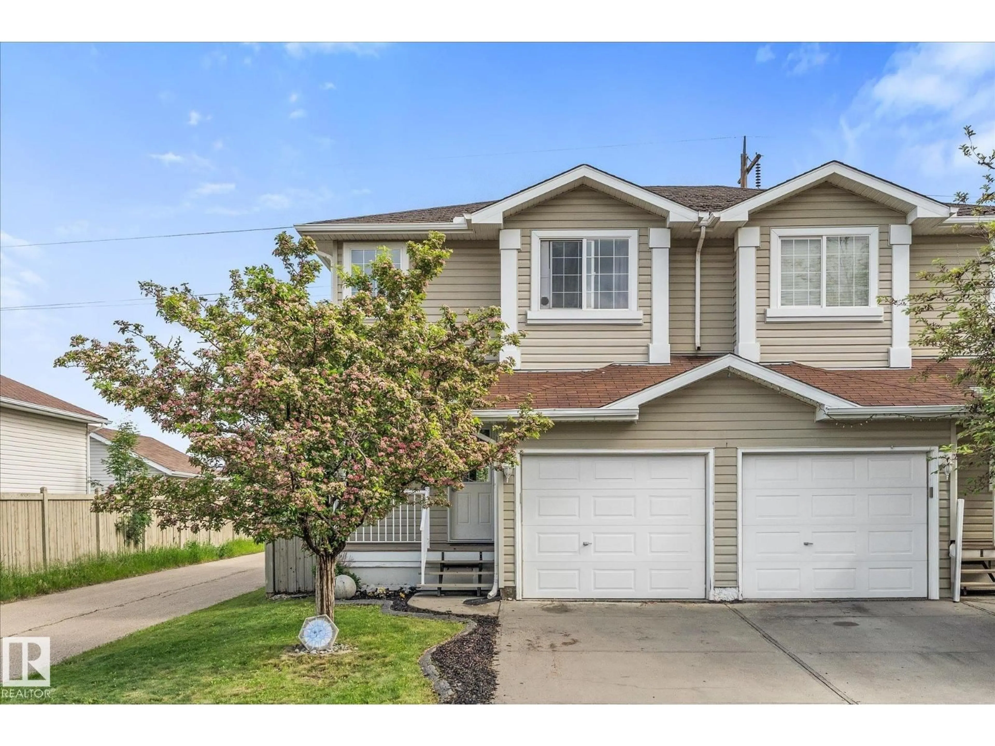 Home with vinyl exterior material, street for 2324 30 AV, Edmonton Alberta T6T2B3