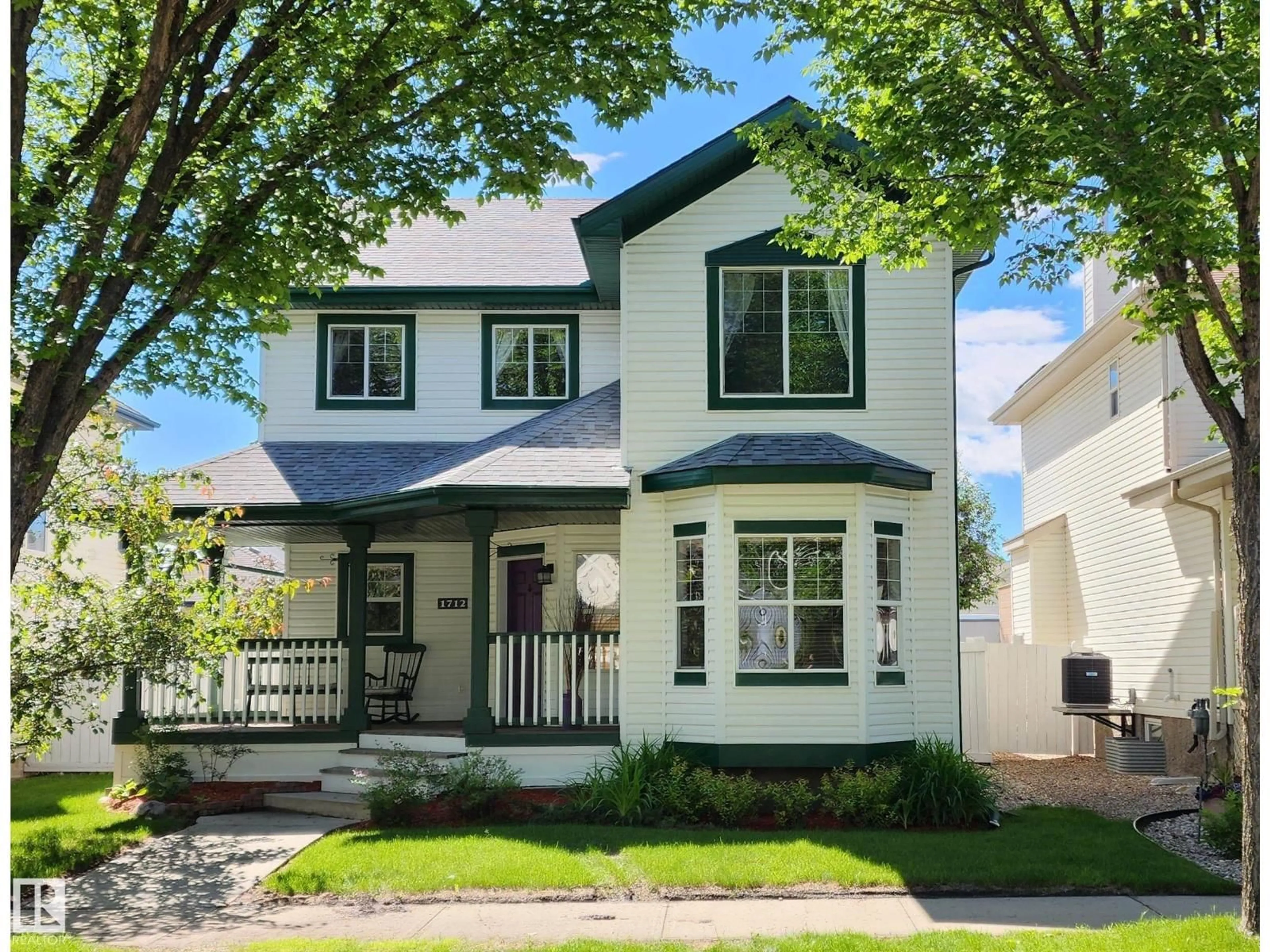 Home with vinyl exterior material, street for NW - 1712 TOMLINSON CM, Edmonton Alberta T6R2W8