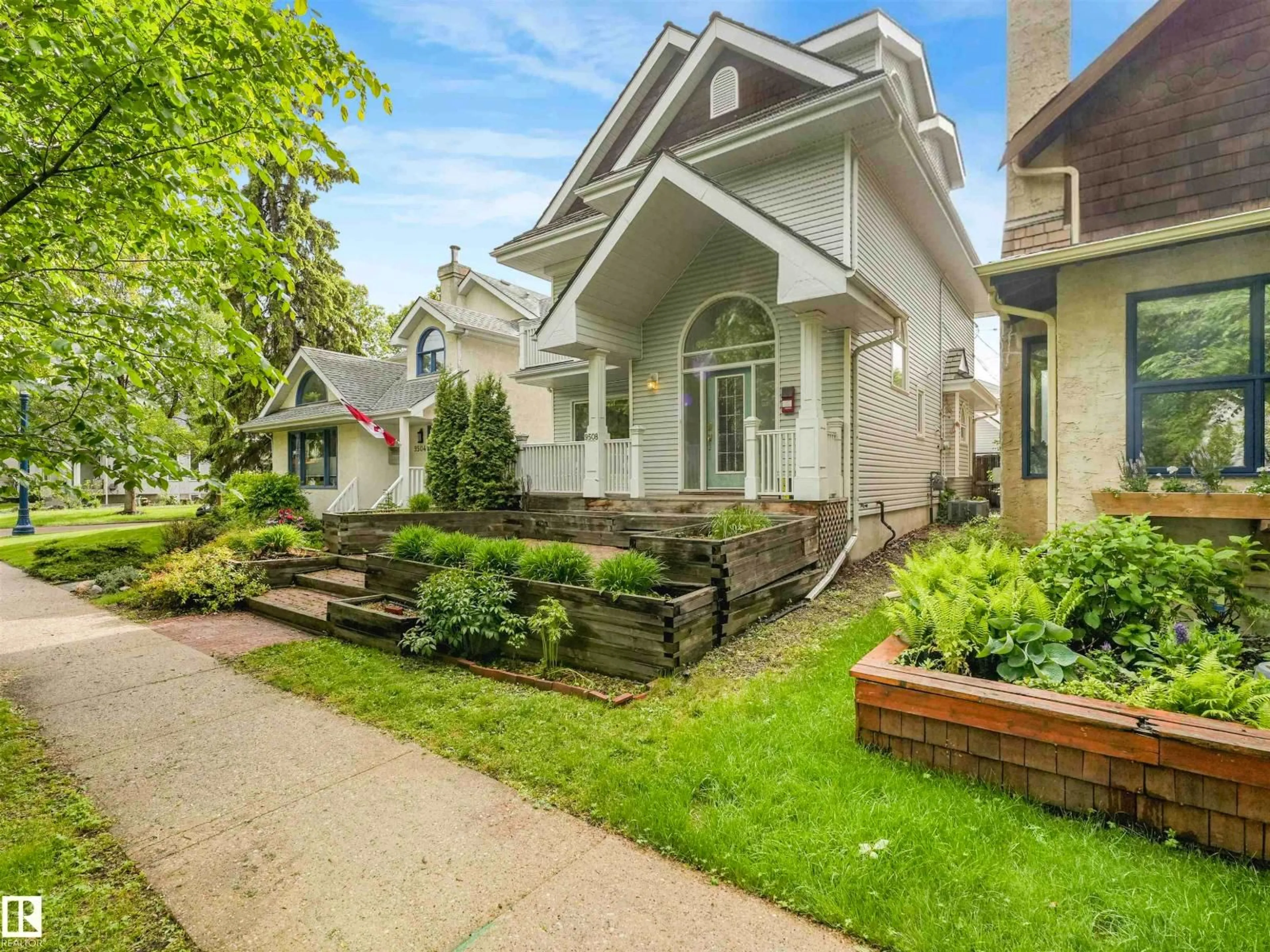 Home with vinyl exterior material, street for 9508 100A ST NW, Edmonton Alberta T5K0V6