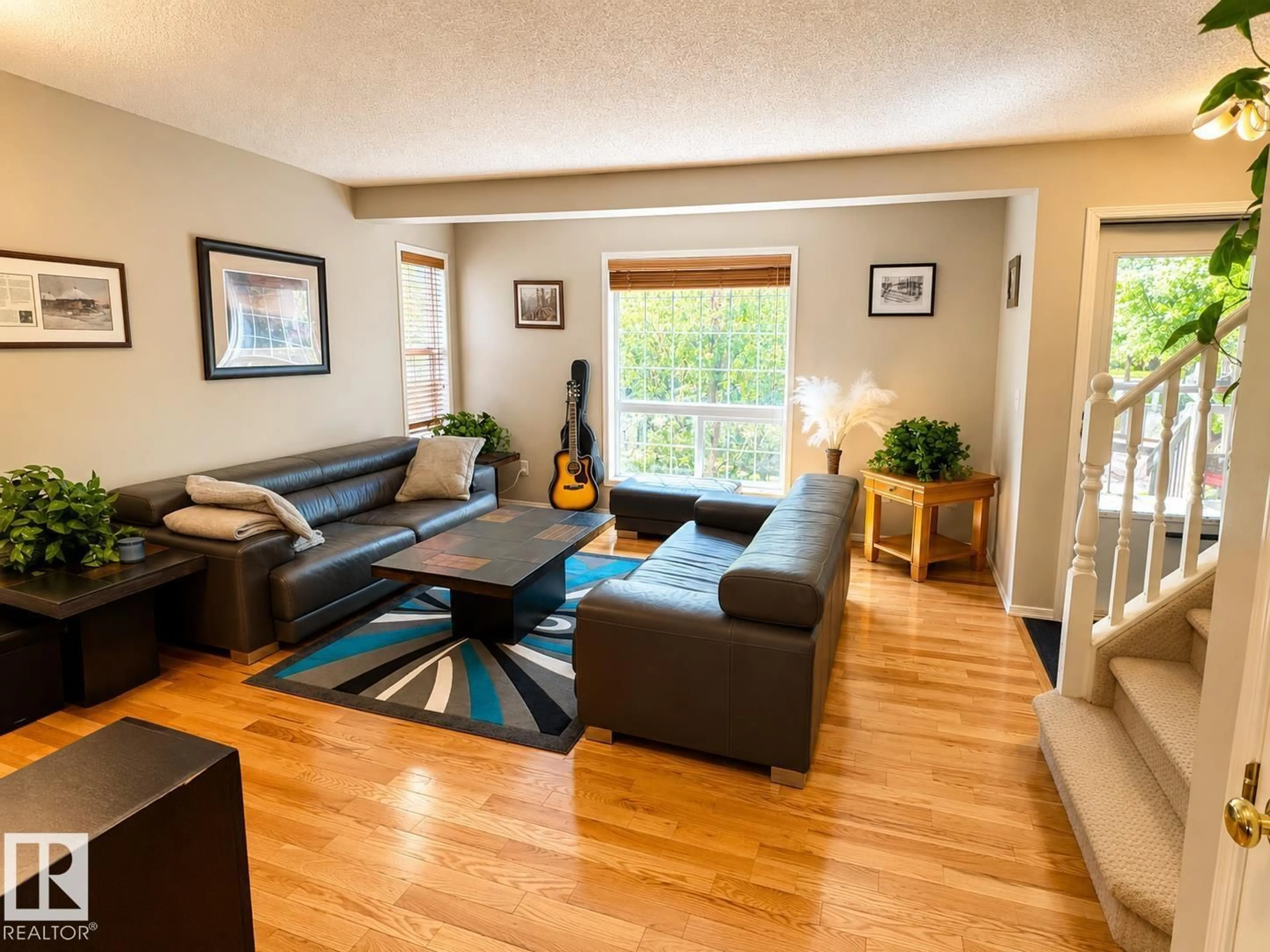 Living room with furniture, wood/laminate floor for 5428 202 ST, Edmonton Alberta T6M2W5