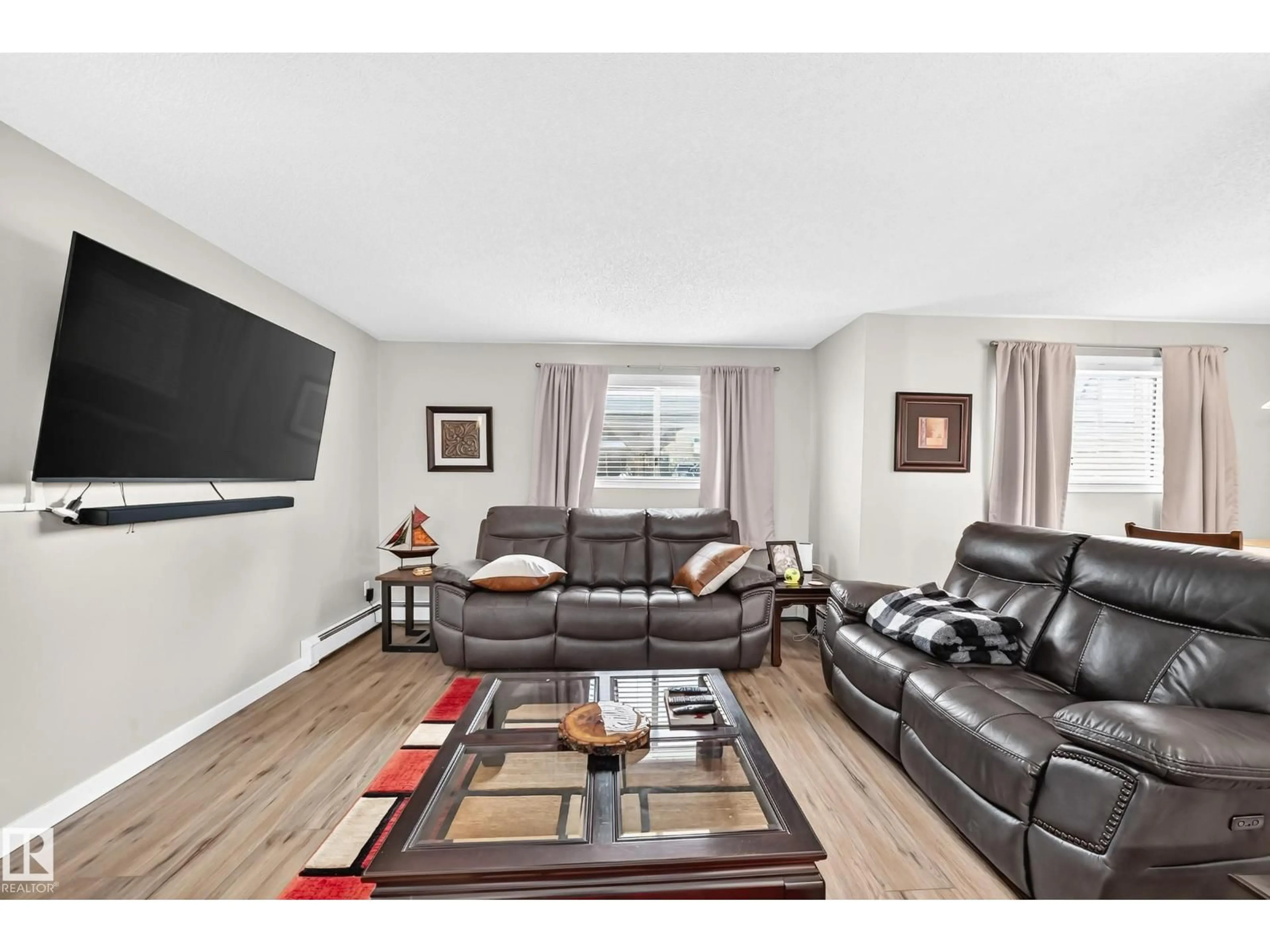 Living room with furniture, wood/laminate floor for 224 - 102 CHURCH RD, Spruce Grove Alberta T7X3E9
