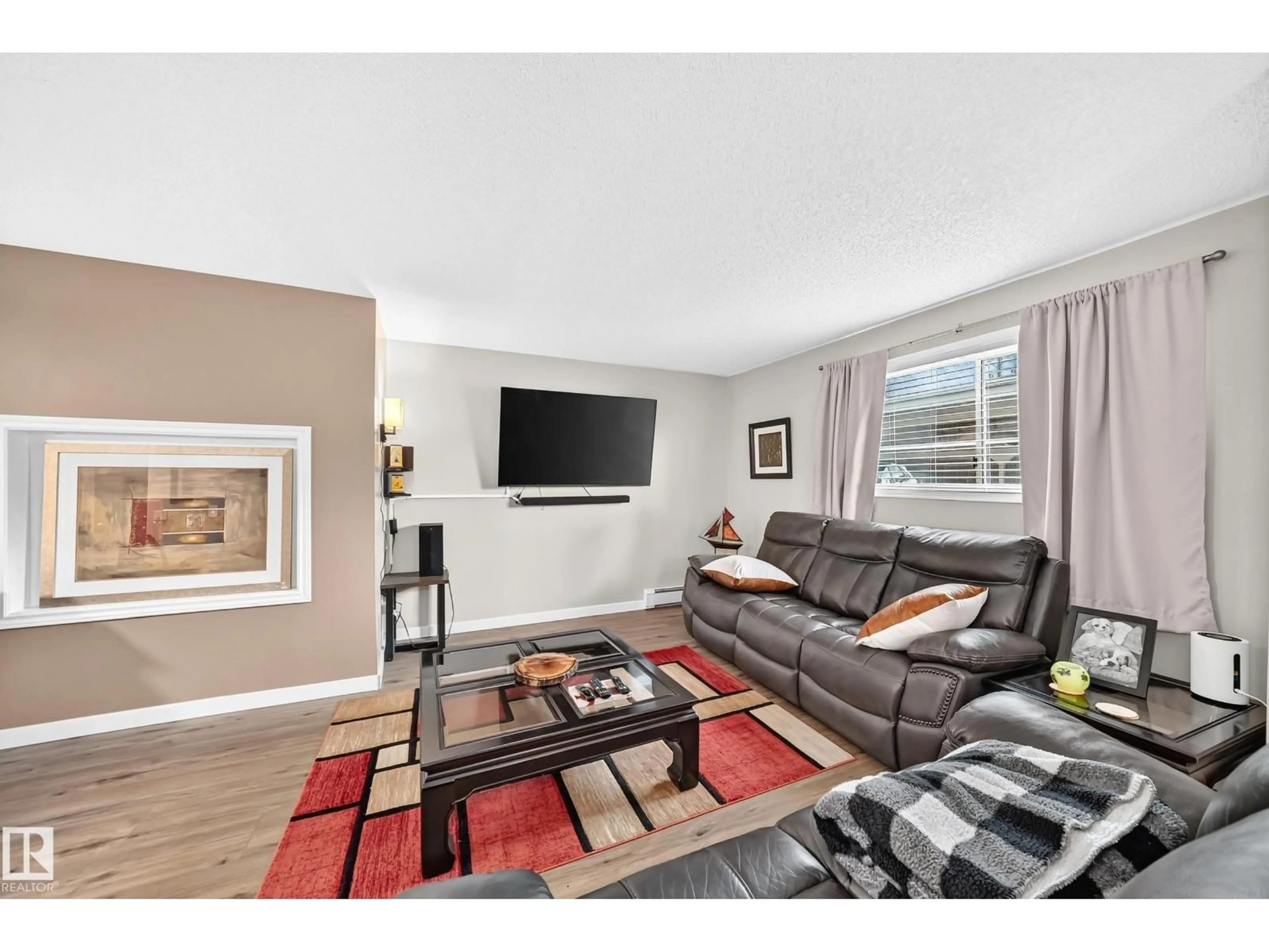 Living room with furniture, wood/laminate floor for 224 - 102 CHURCH RD, Spruce Grove Alberta T7X3E9