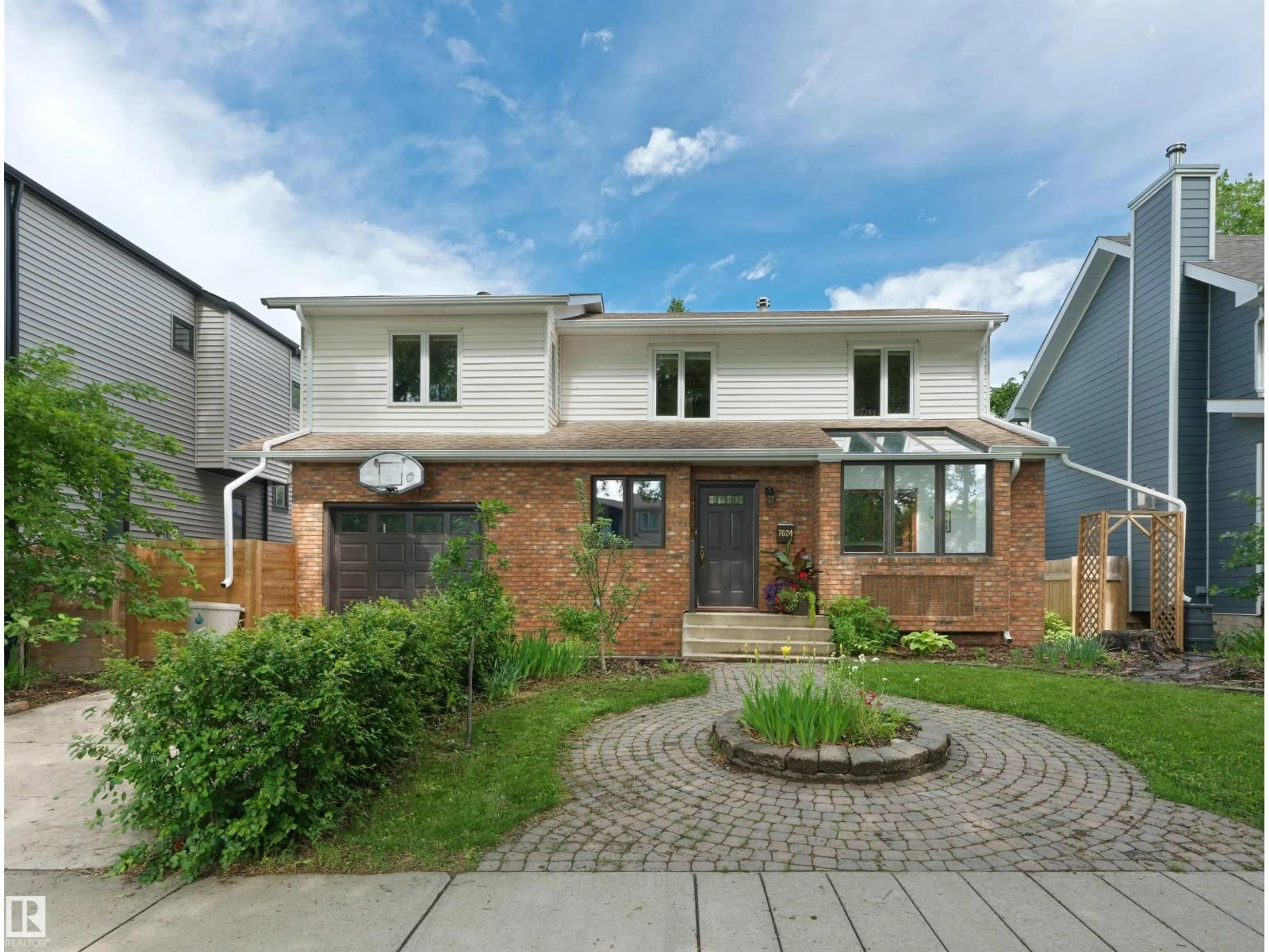 Home with brick exterior material, street for 7624 92 AV, Edmonton Alberta T6C1R4