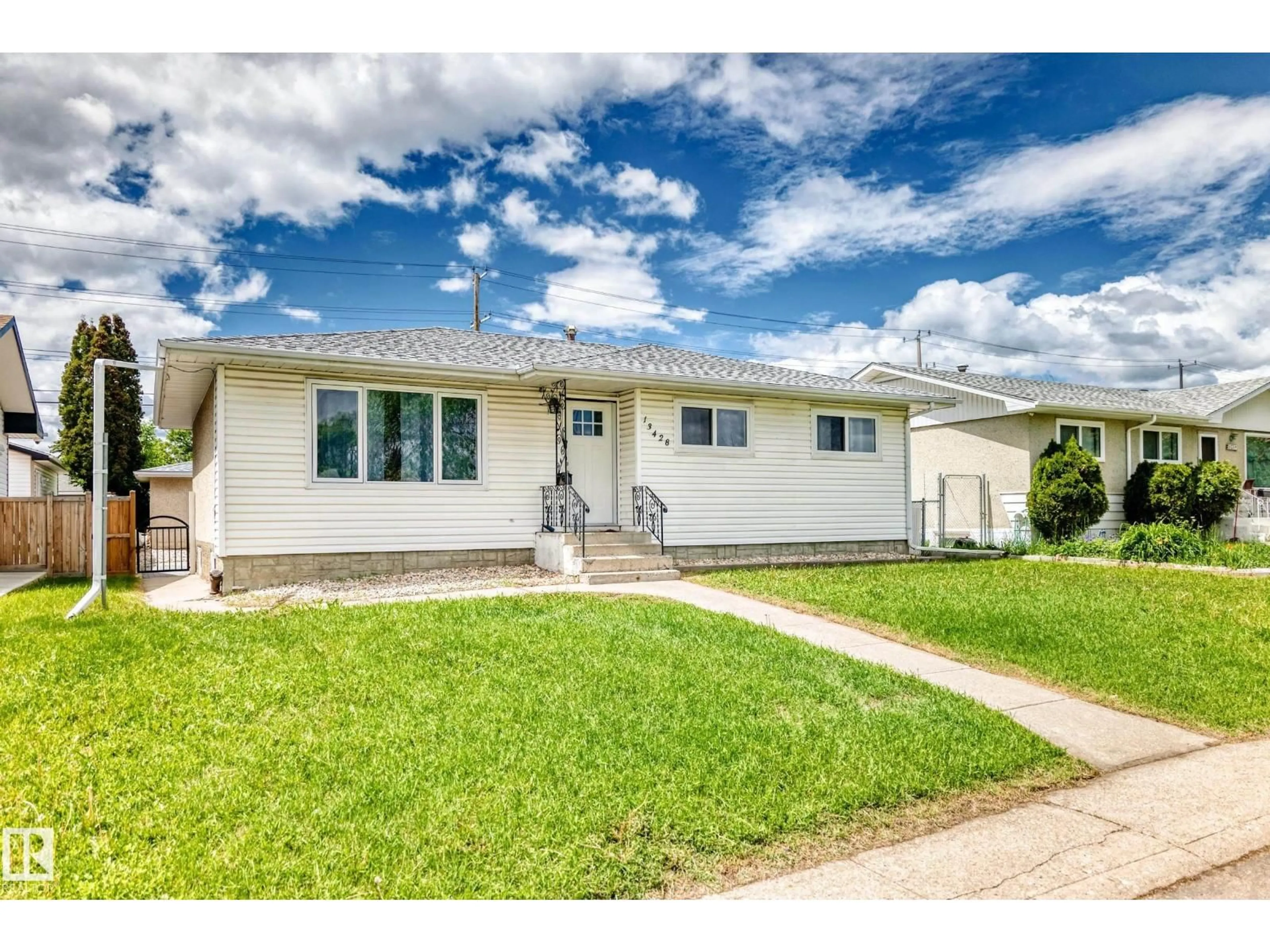 Home with vinyl exterior material, street for NW - 13428 82 ST, Edmonton Alberta T5E2V2